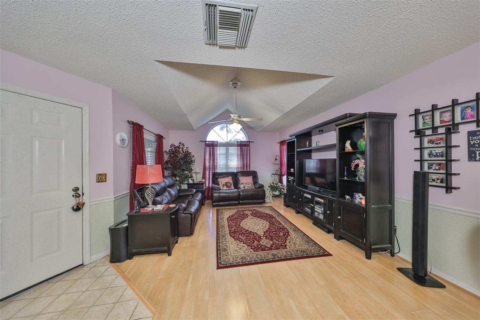 Cathedral ceilings, oversized windows and clean interior make for a comfortable and spacious living area.