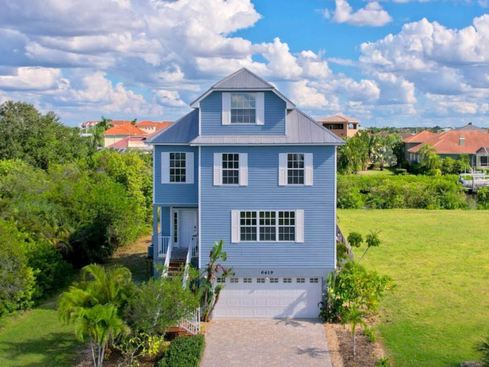 Extraordinary 4 story|5 bedroom|2.5 bath coastal lifestyle in Apollo Beach on canal with private dock and pool/spa.  No HOA or CDD!!