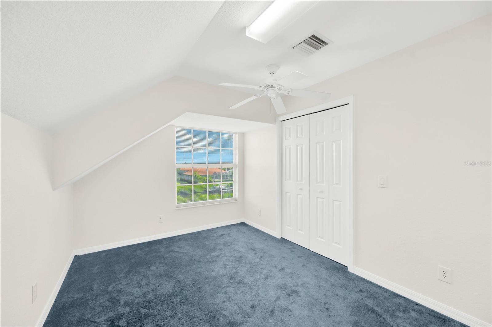 Bonus room has built in closets and ceiling fans and is a spacious flex space or could be divided into 2 more secondary bedrooms.