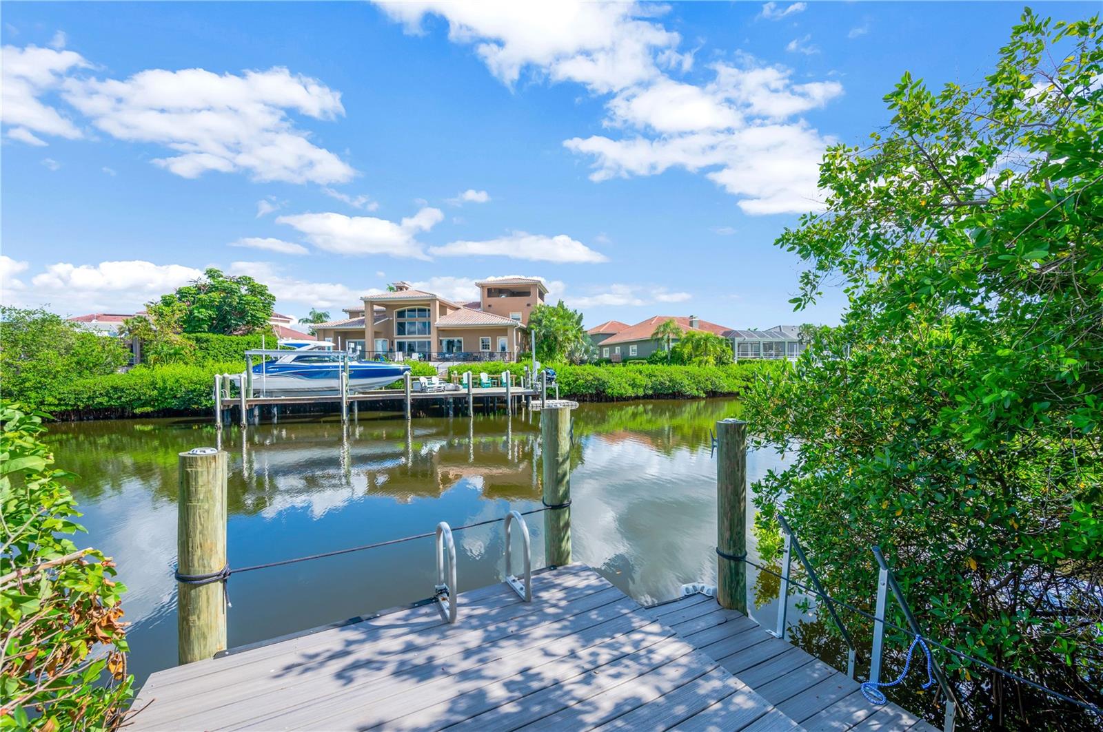 Private boat dock in backyard with access to salt water canal, Apollo Beach Marina and waterfront dining, has bridge-free access to the Tampa Bay & Gulf of Mexico.