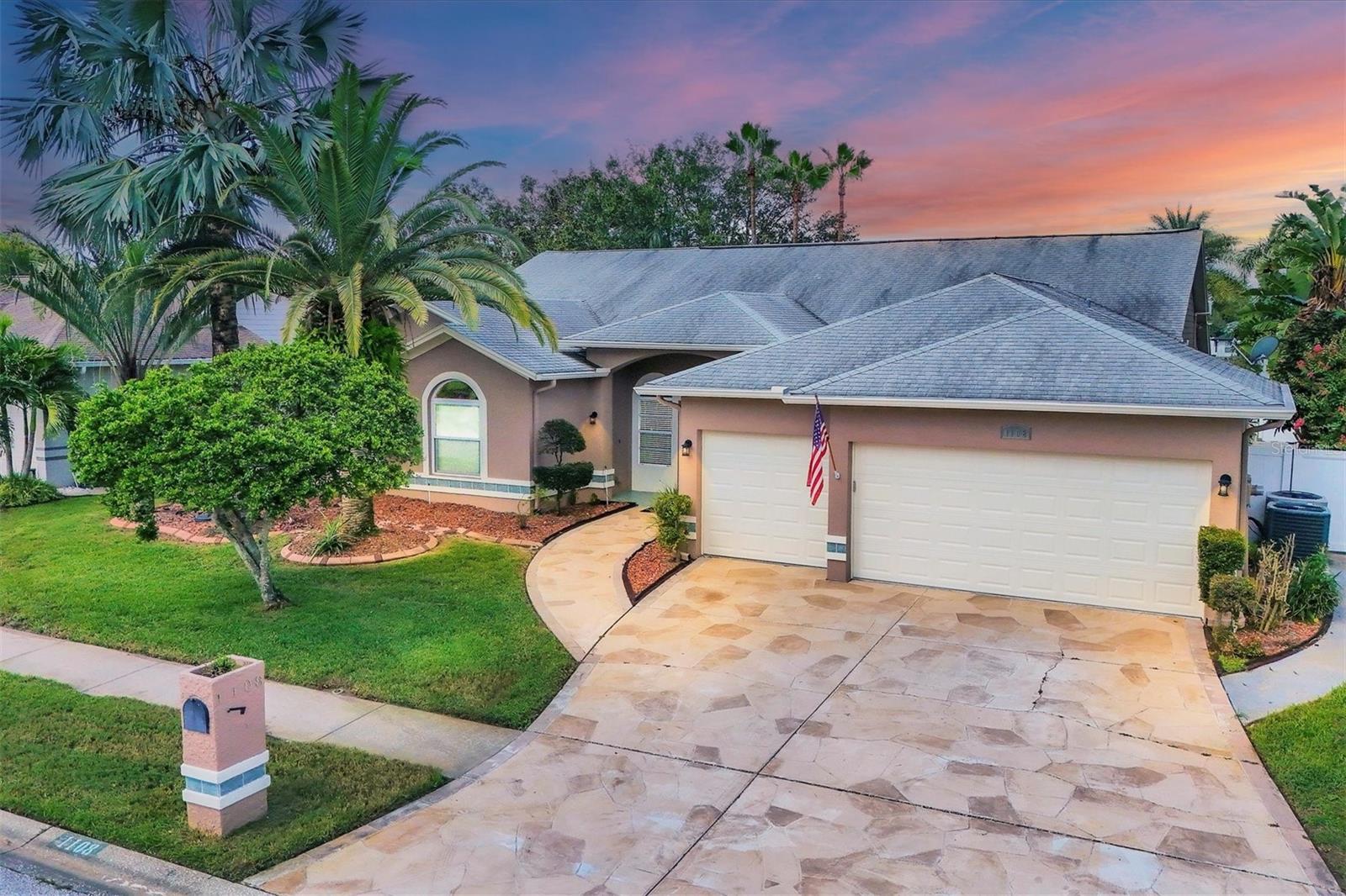 Freshly painted exterior in Aug 2024!  Stamped concrete driveway adds to the curb appeal of this beautiful home.