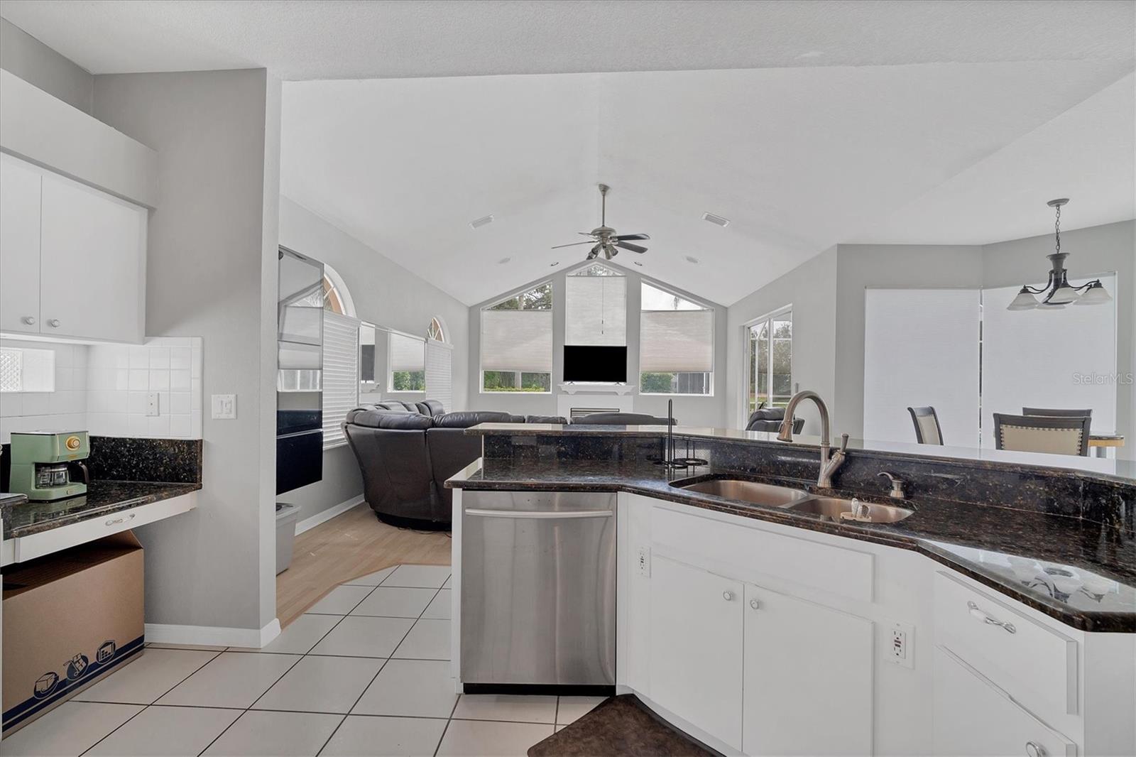 Kitchen overlooks family room and dinette