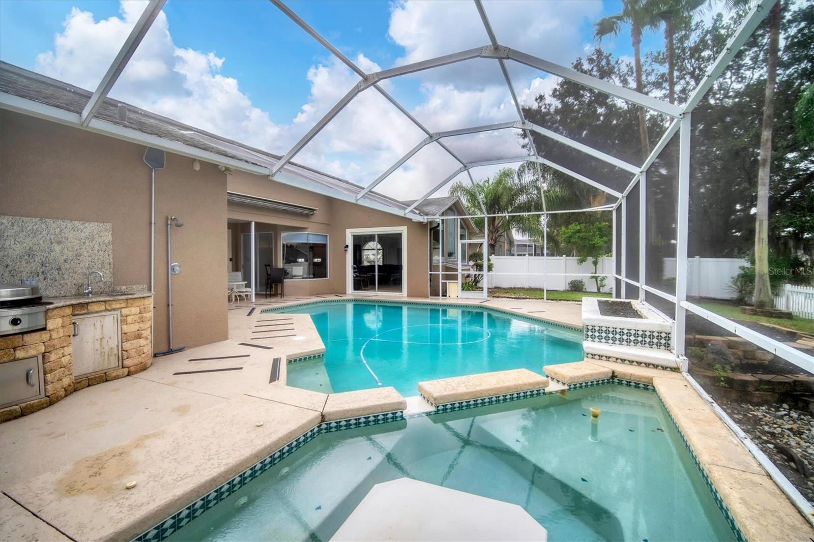 View from spa into house and backyard.  Family room behind double sliders.