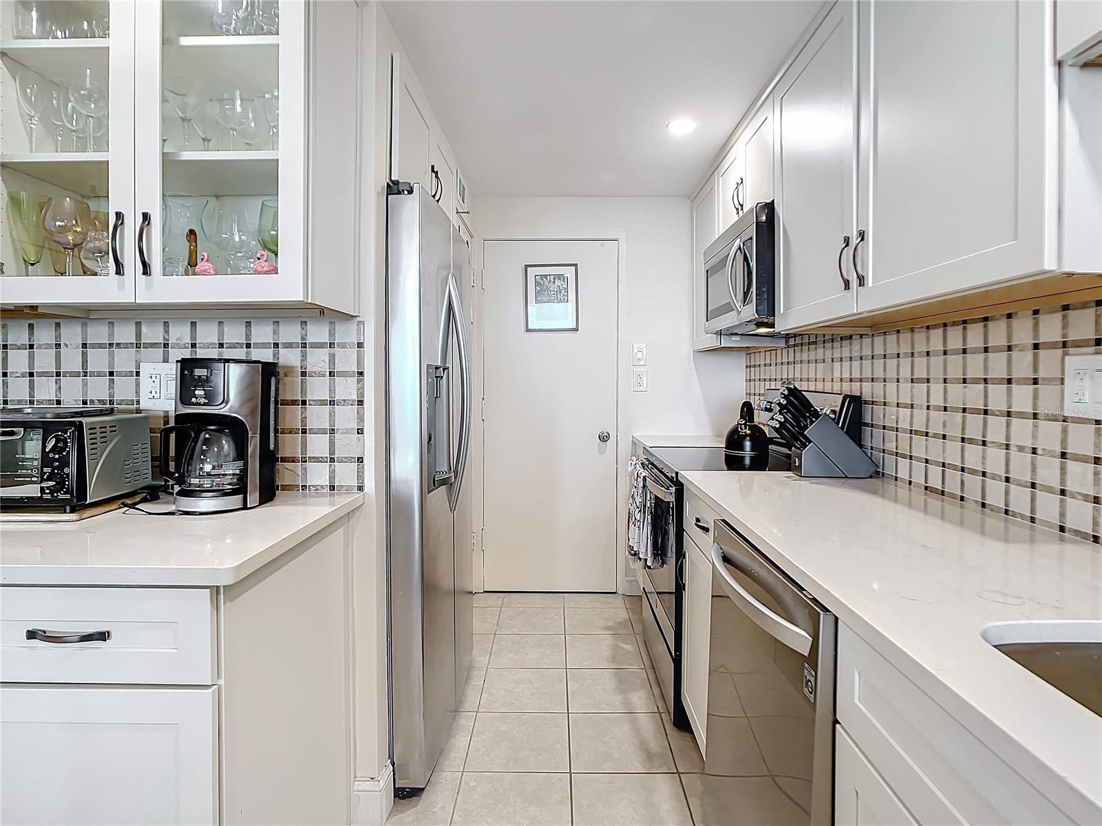 This kitchen offers you lots of counter space for meal preparation and entertaining.