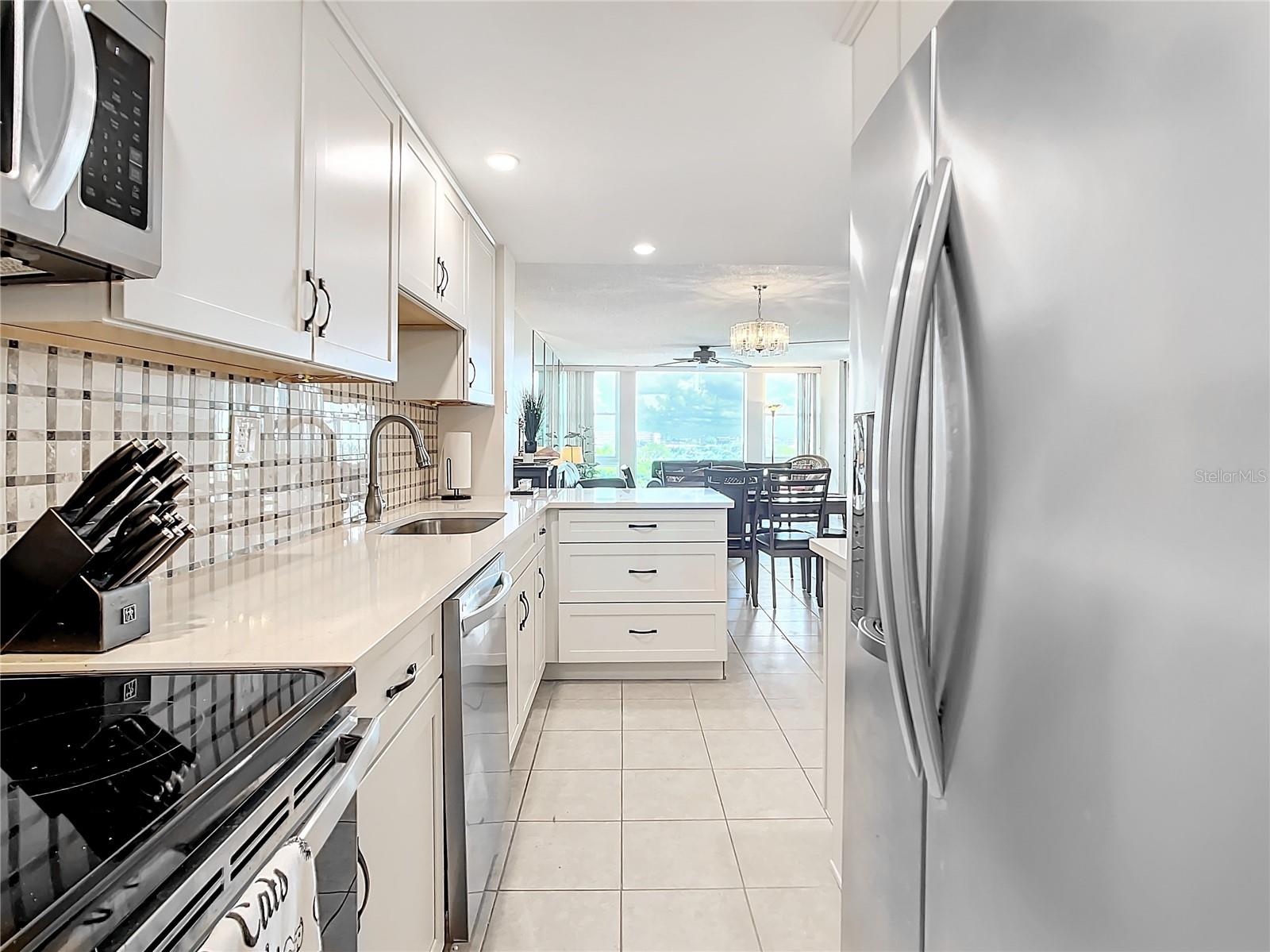 This is your view looking out from the back of the kitchen.  Notice your double door refrigerator with a water dispenser.