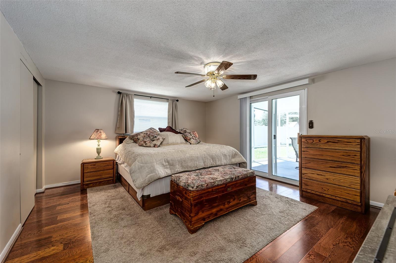 Primary bedroom with sliding door to large lanai