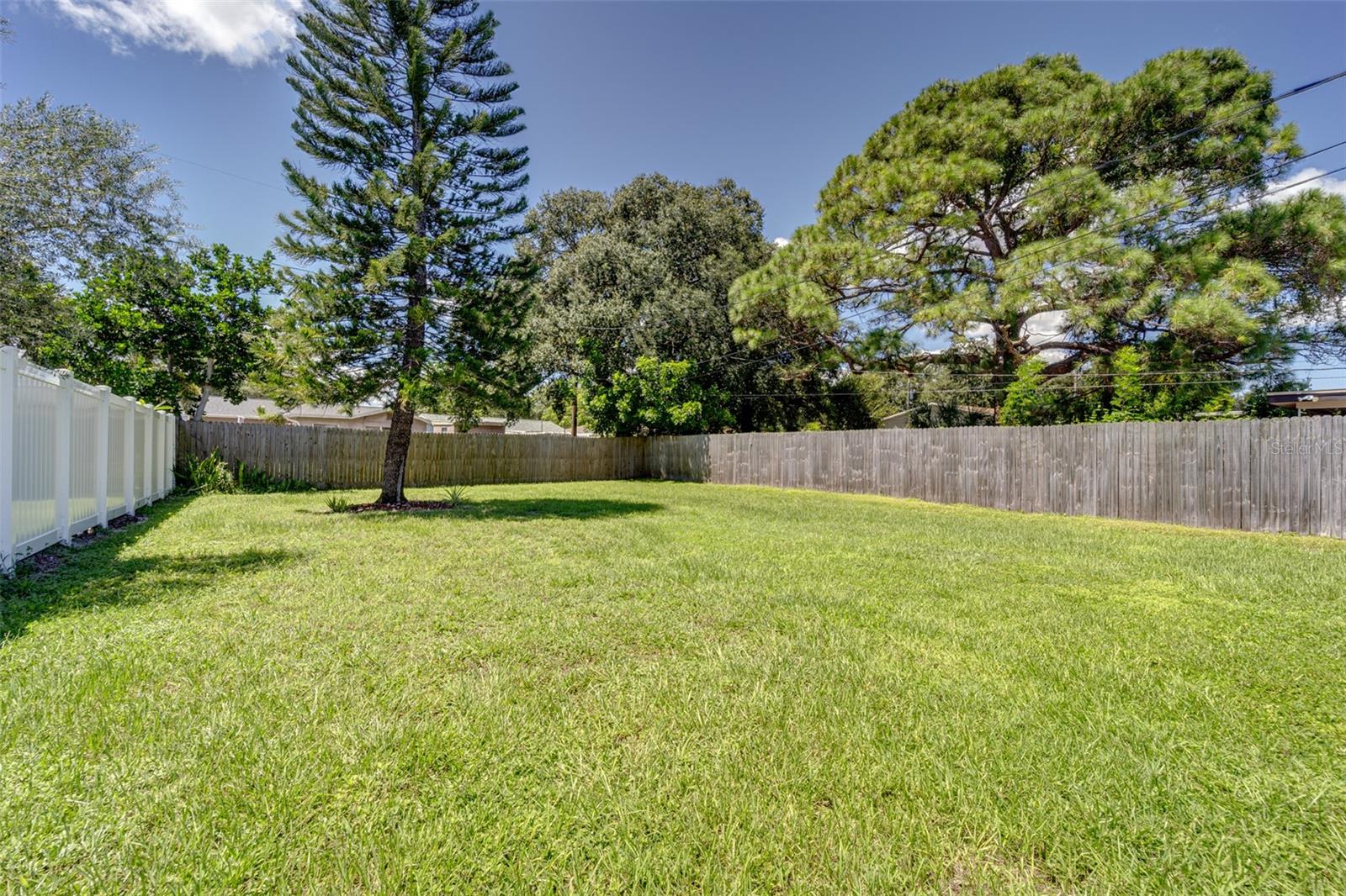 Huge rear yard with rear fence along alley offering additional access to the property if desired