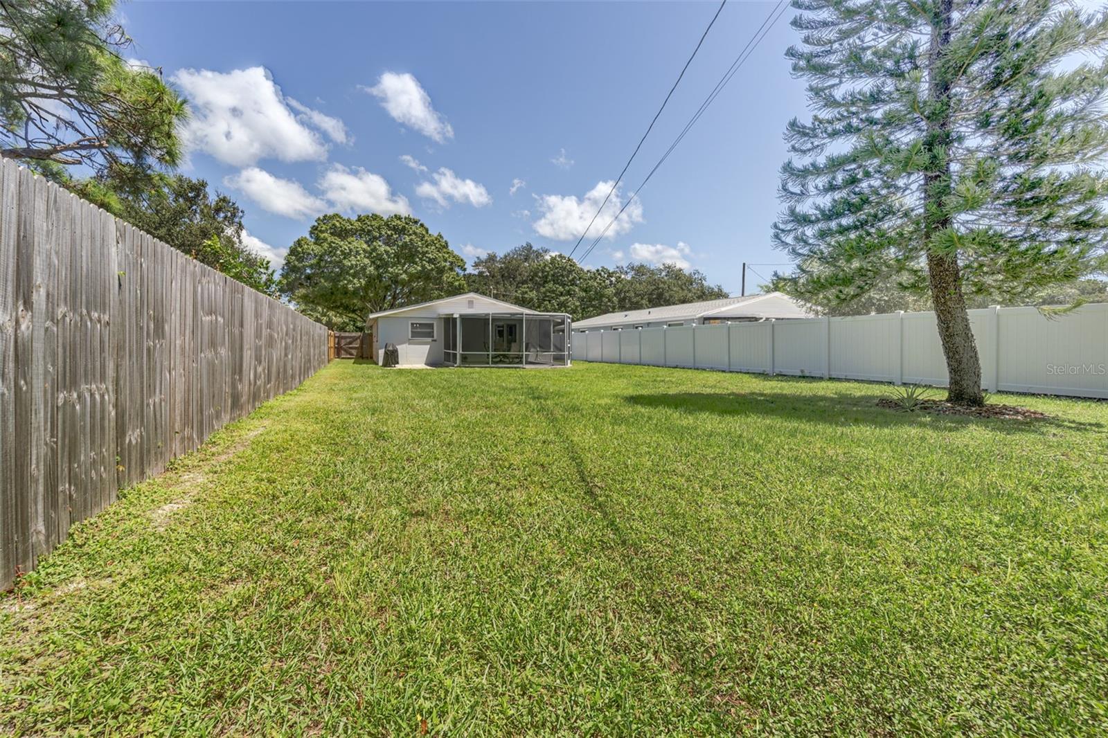 View from rear of yard to lanai and back of home