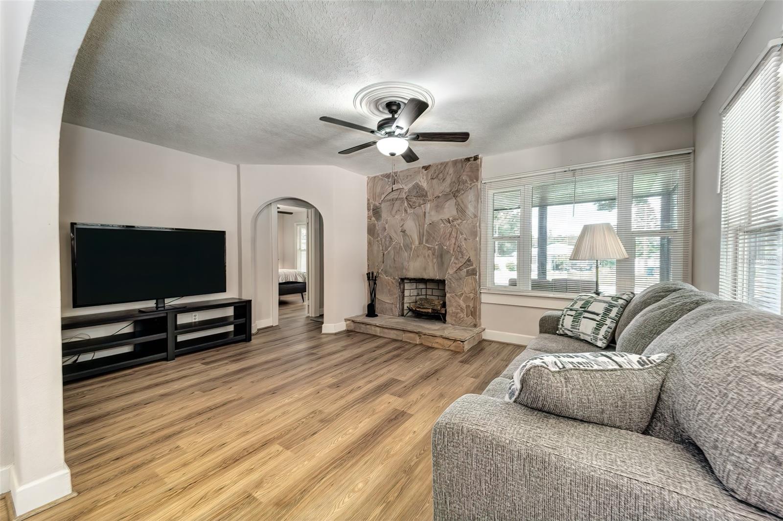 Plaster walls and ceiling painted in soft beiges and creams in a neutral color palette...plaster medallions adorn the ceiling fans in both the living and dining rooms