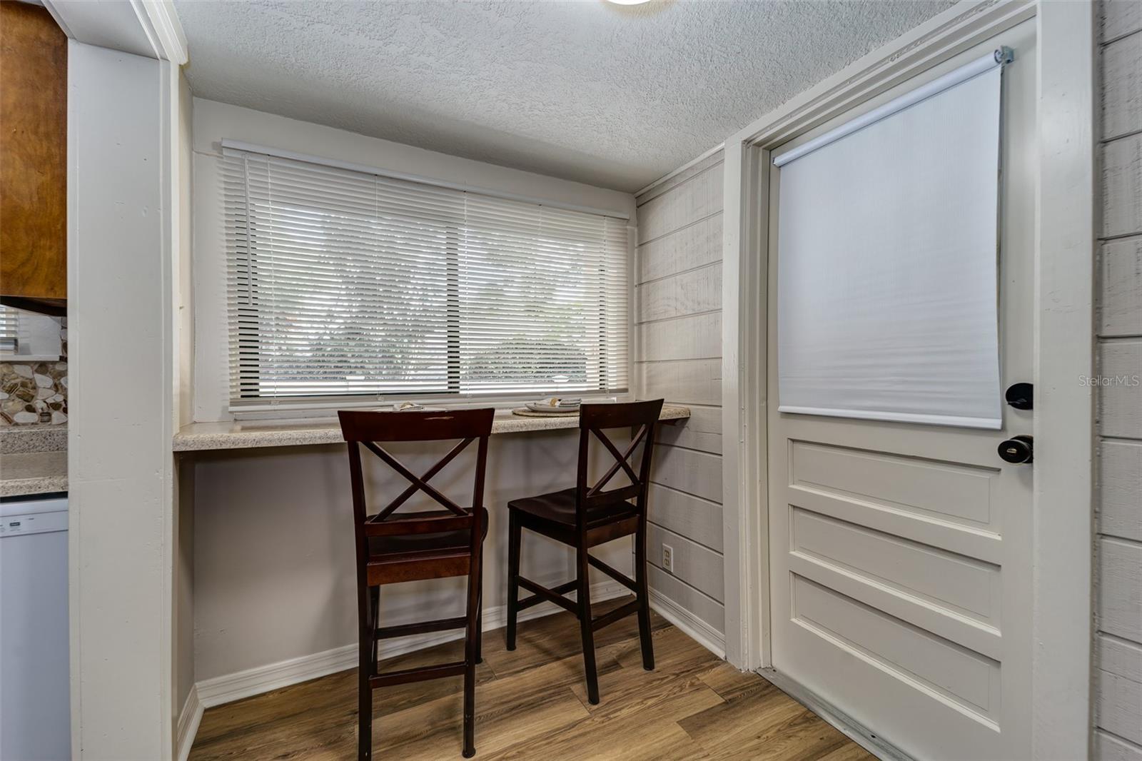 Breakfast bar to enjoy morning coffee....entrance to garage on right...