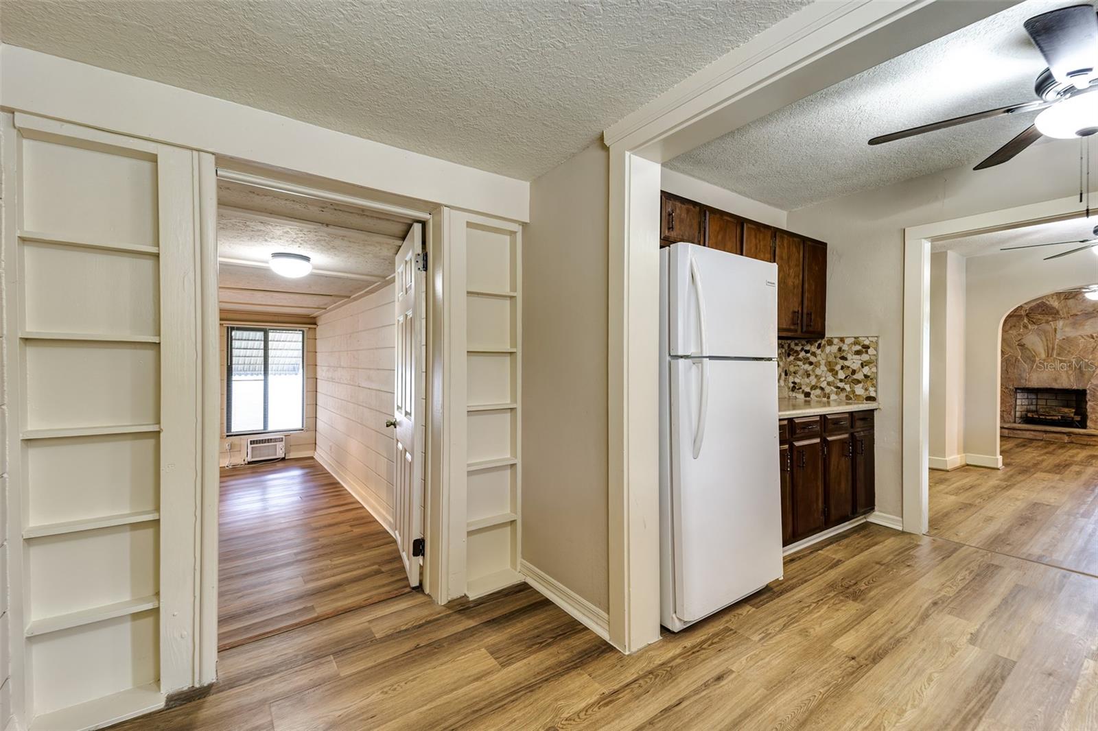 View to entrance of third bedroom/office and kitchen to living and dining rooms