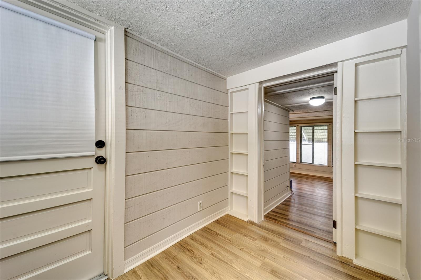 Entrance to third bedroom/office....door on left is garage entry from kitchen