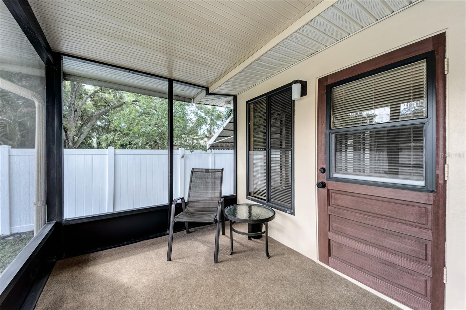 Private rear, screened porch for relaxation...separate entrance to bedroom/office!