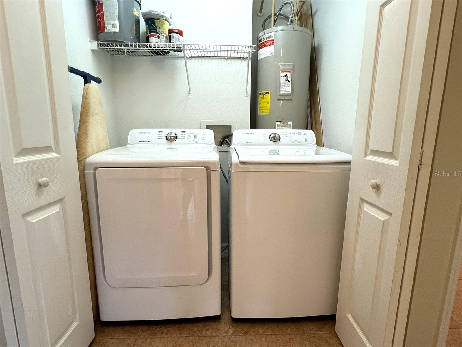 Laundry closet and water heater.