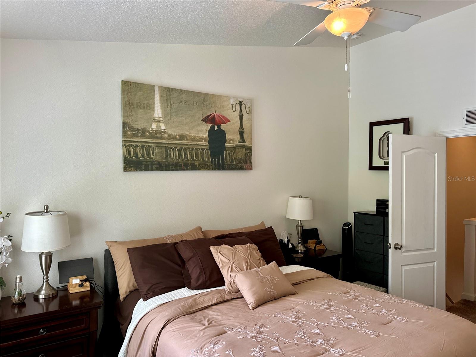 Primary bedroom overlooking pond