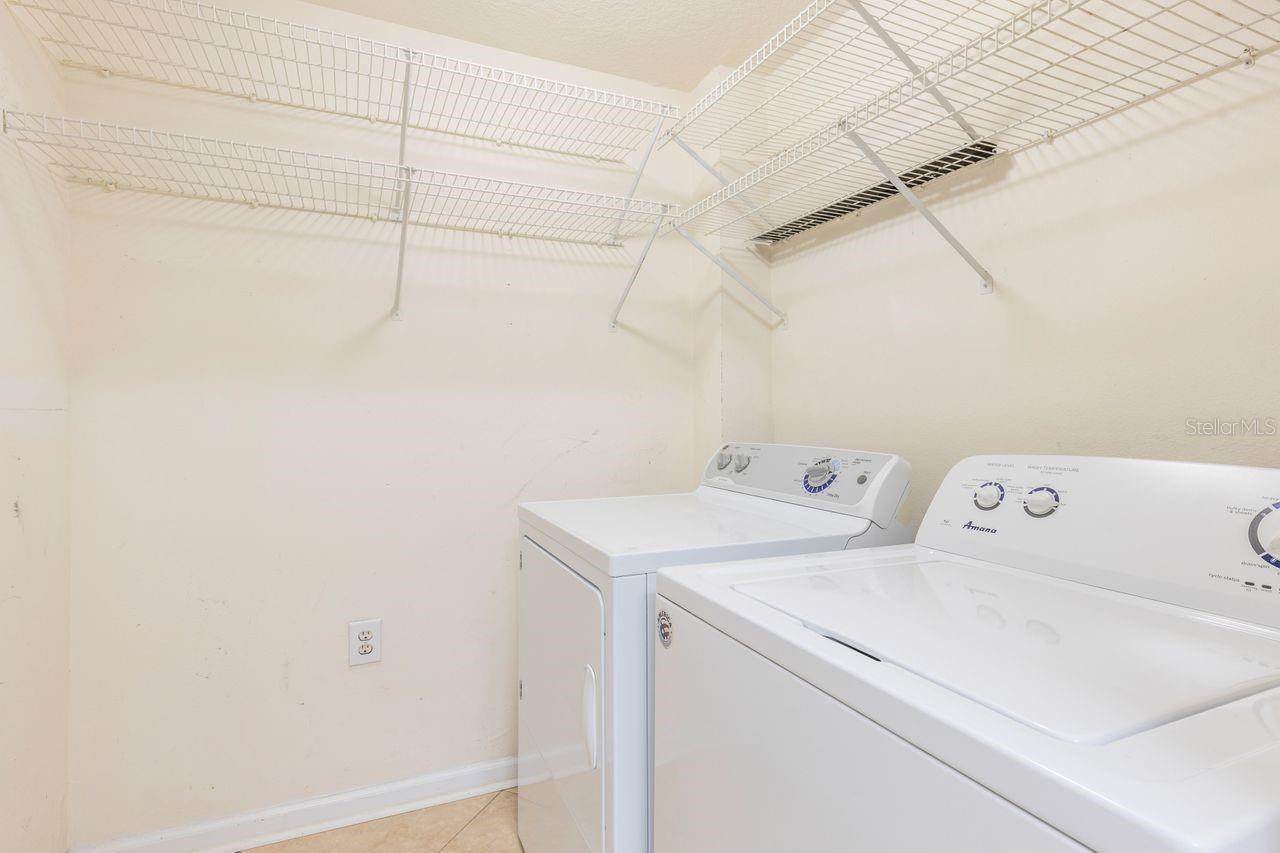 Large laundry room with plenty of storage space