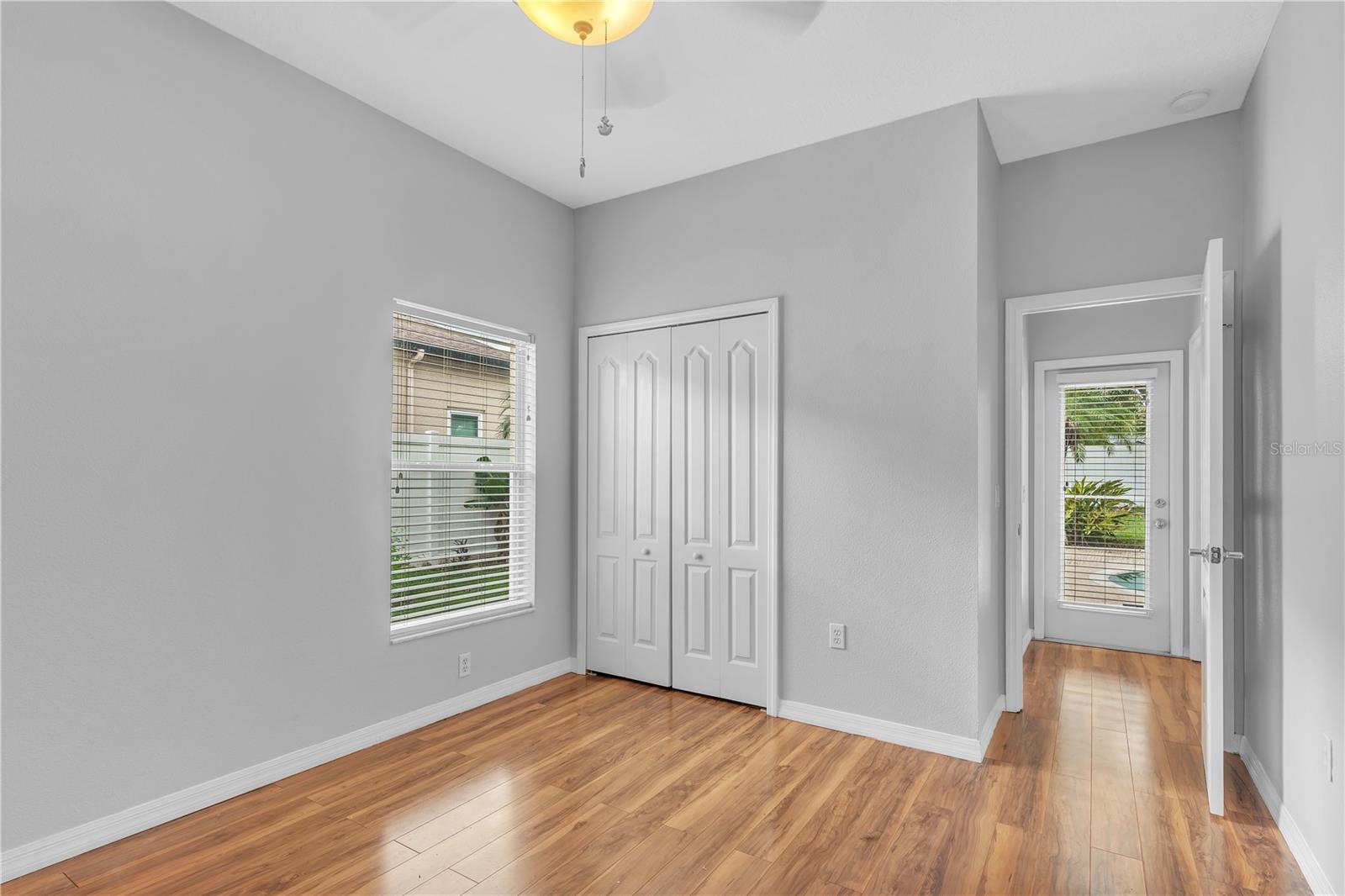 FIRST FLOOR 5TH BEDROOM WITH BATH AND ENTRY DOOR TO LANAI AND POOL/SPA