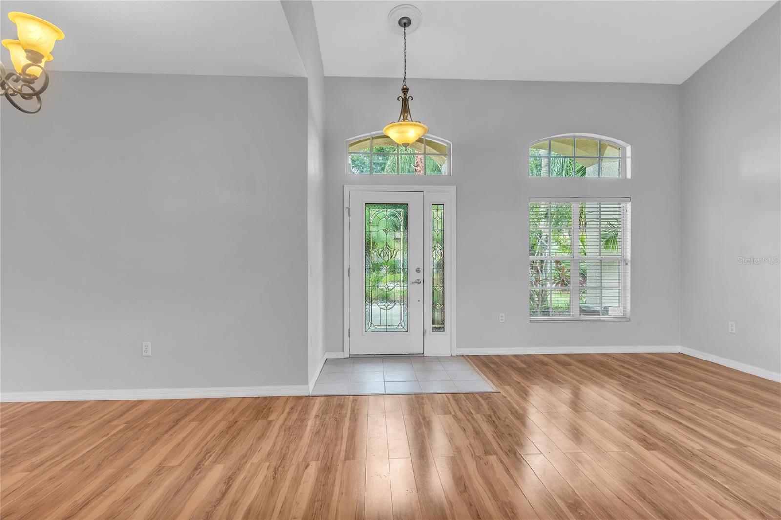 FRONT ENTRY FROM BACK OF LIVING ROOM WITH DINING ROOM ON THE LEFT