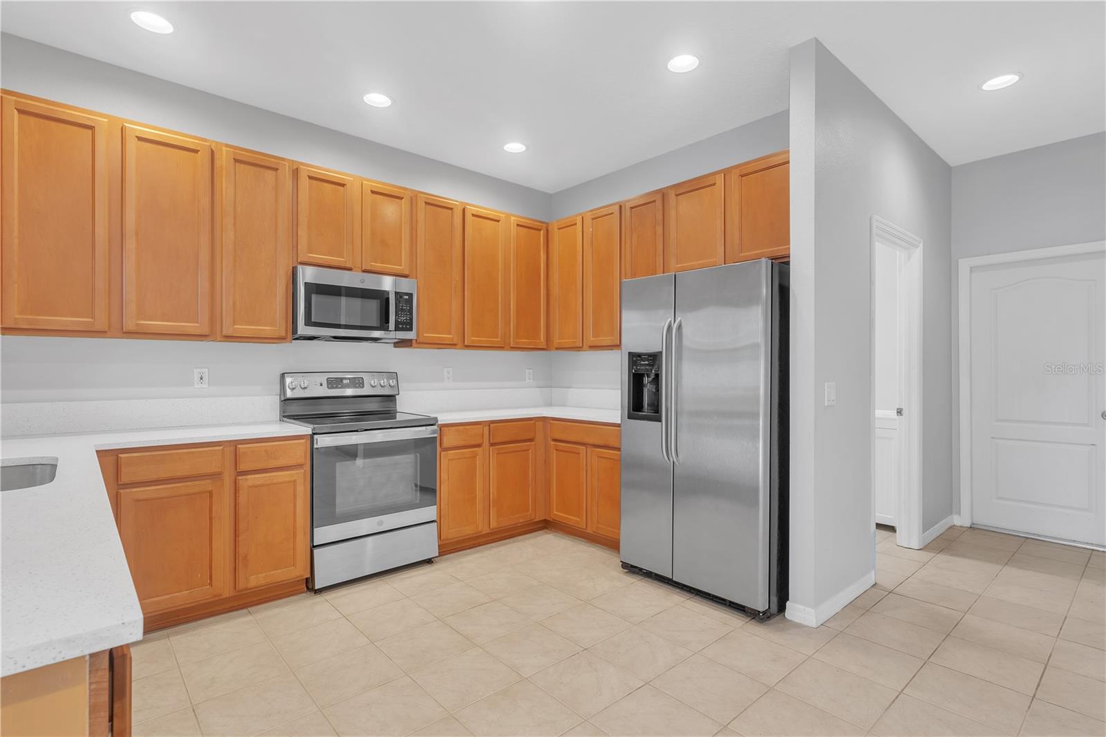 KITCHEN WITH ENTRY TO LAUNDRY AND GARAGE