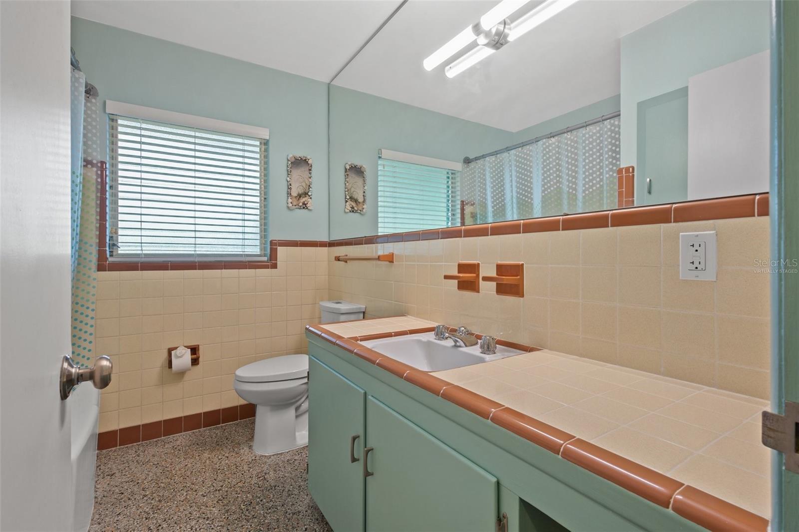 Full bath with original tile vanity