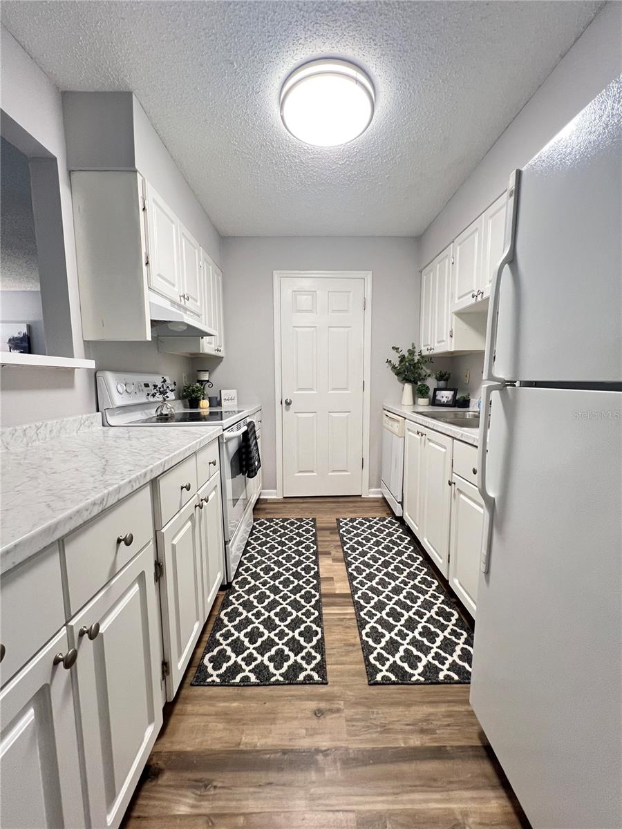 The kitchen has a lot of counter space and cabinets too!