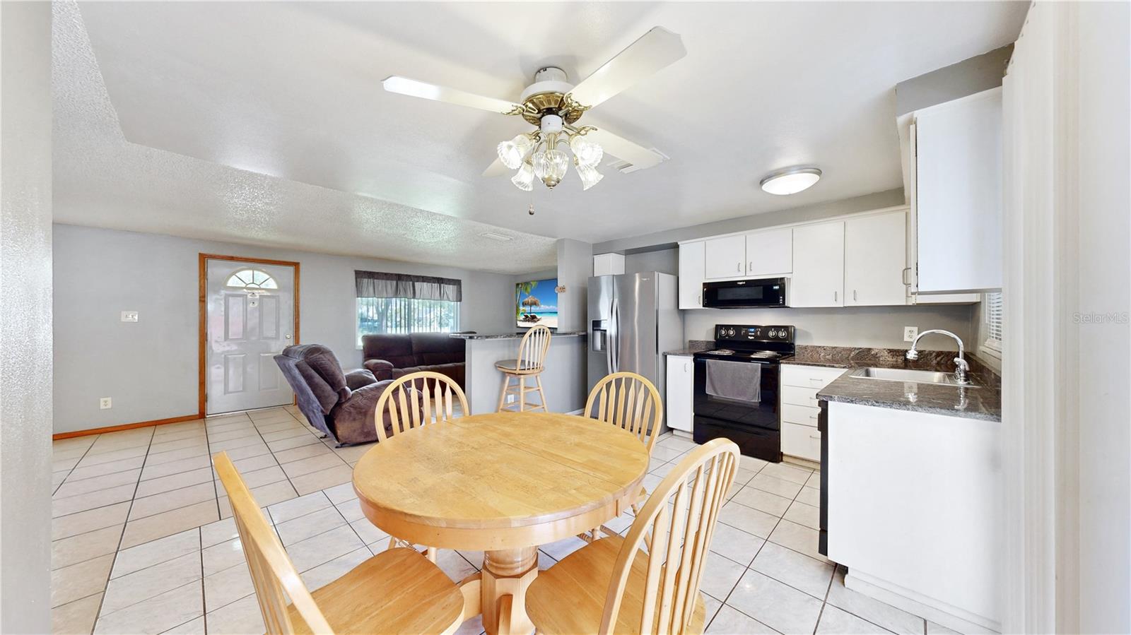 Eat In kitchen overlooks the screened in porch and yard.