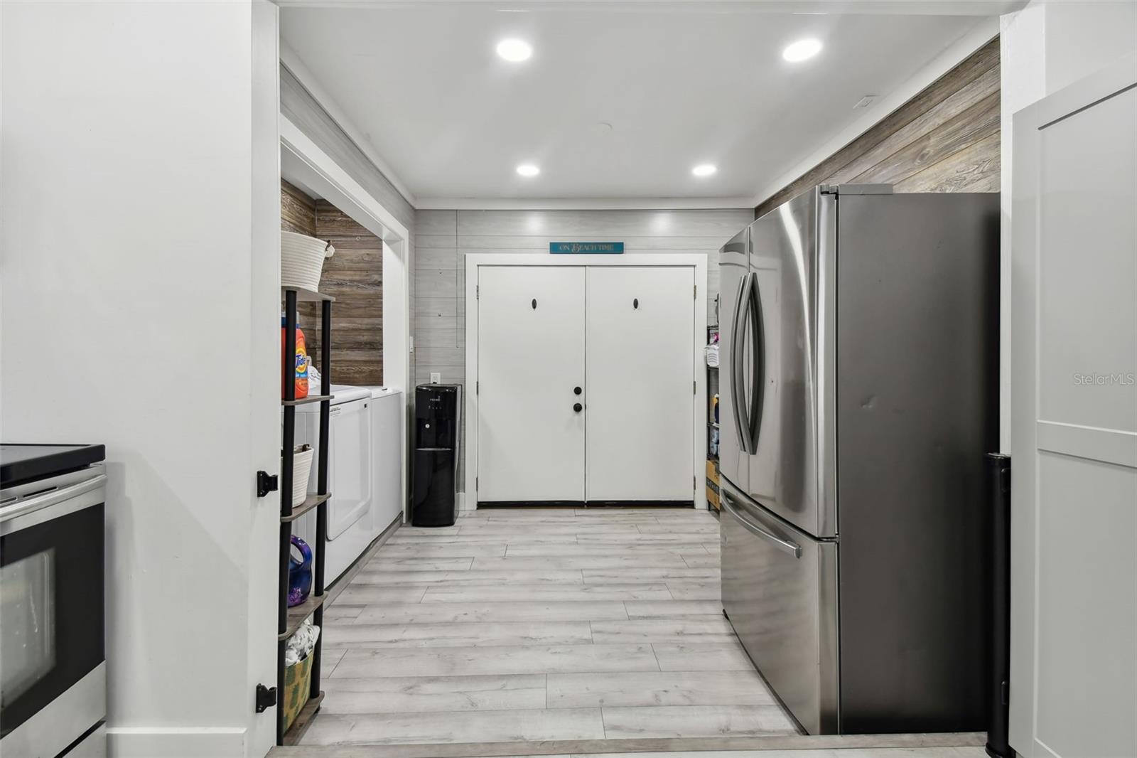 view from kitchen of laundry area