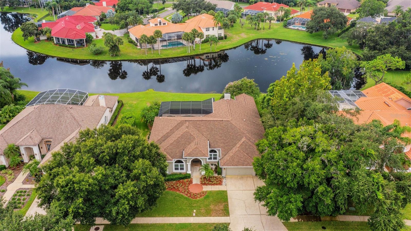 Pond views from this magnificent Lansbrook home in a gated community!