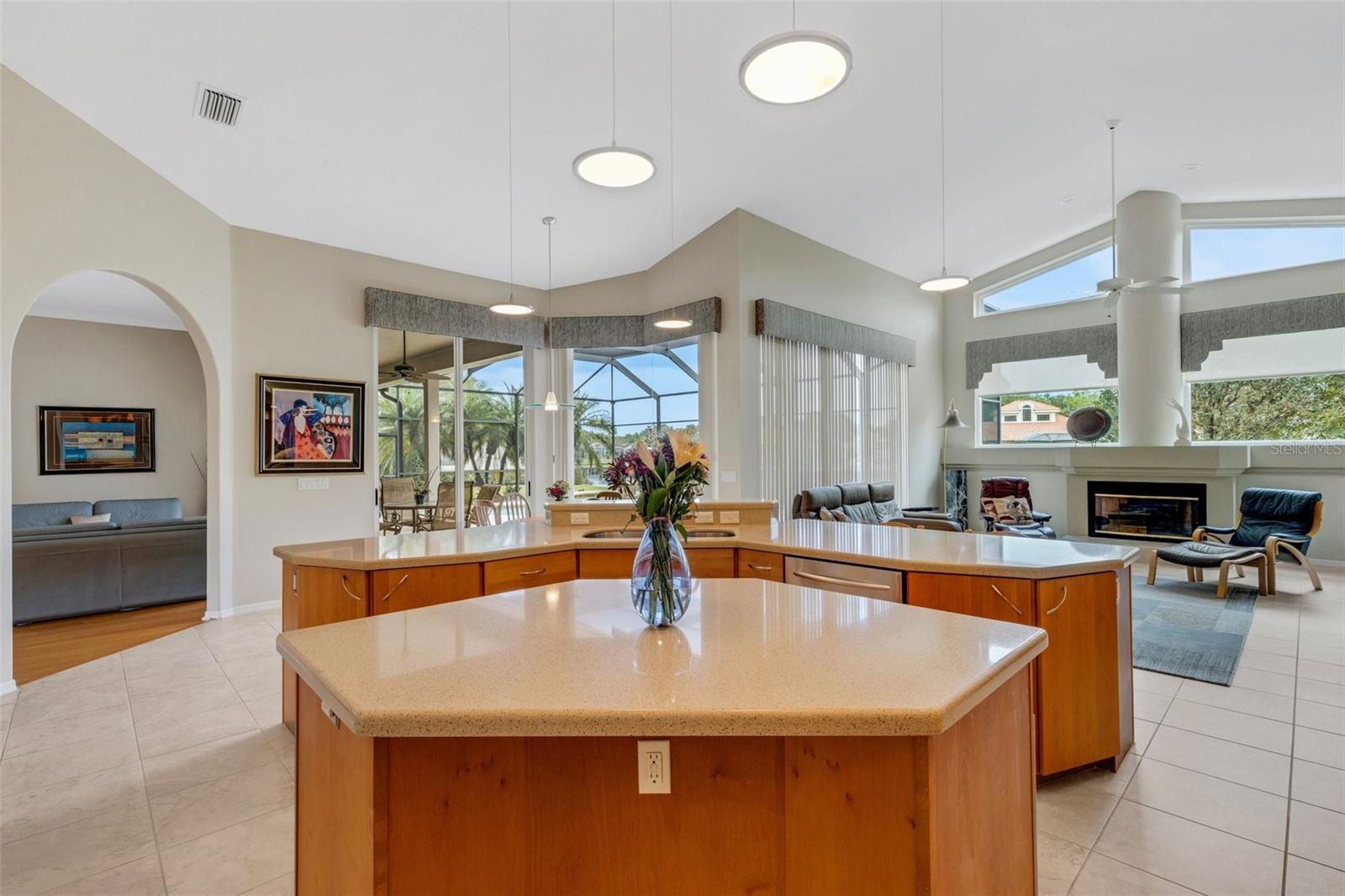 Large island with cabinets, bookshelf and electric!