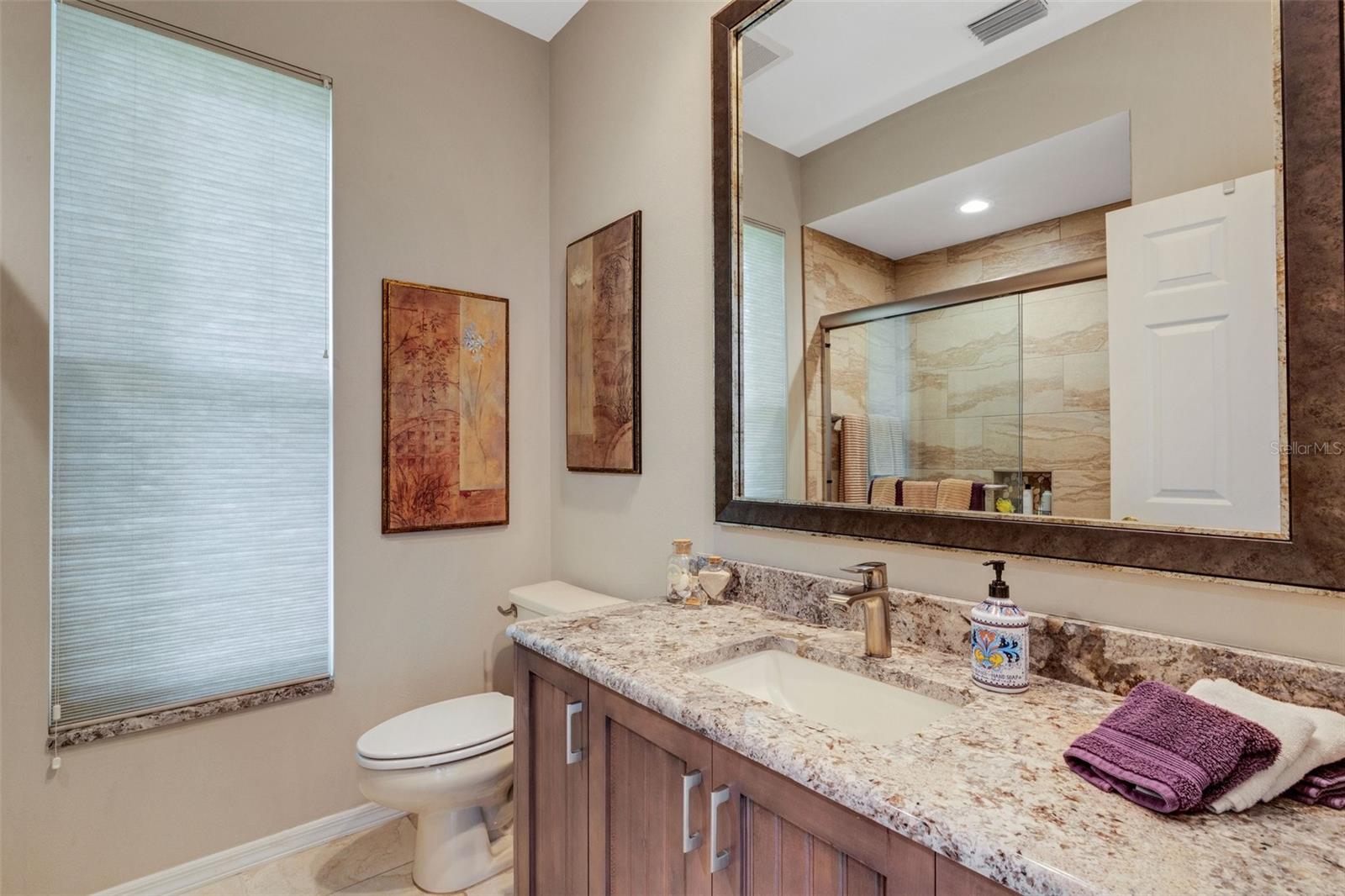 Full bath, next to bedroom #2, part of the mother-in-law suite