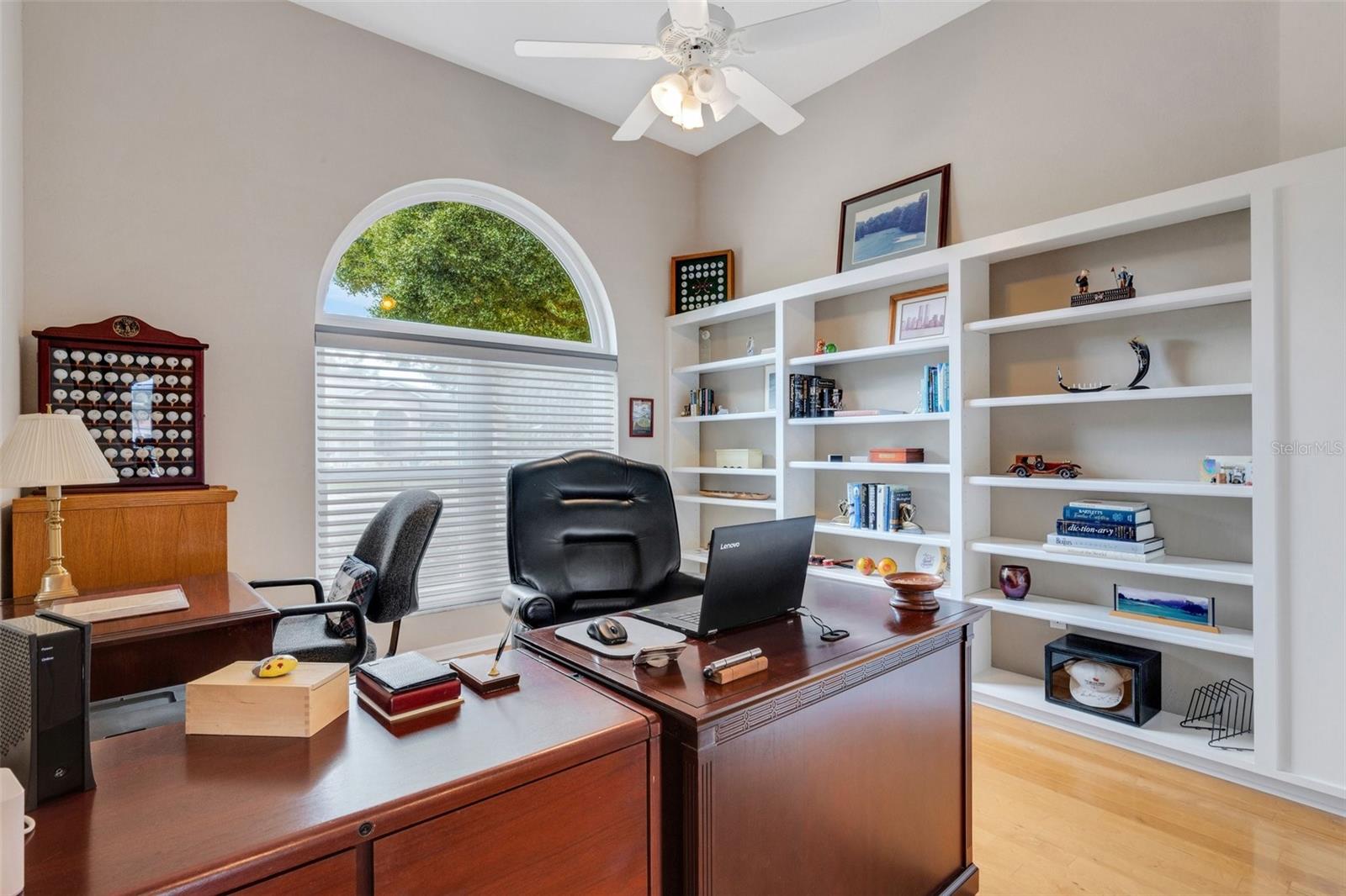 Office in front of home with built-in shelves and a closet!