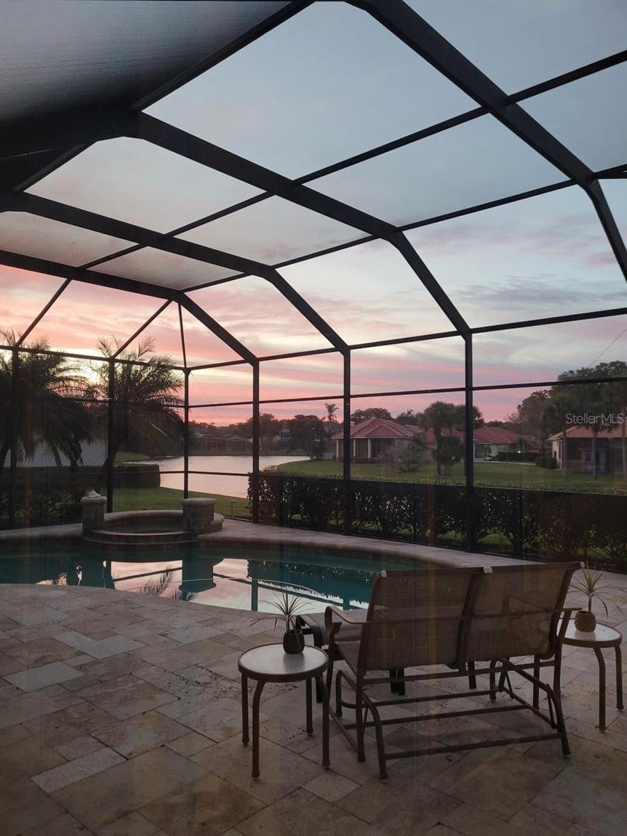 Sunrise over the pond and pool