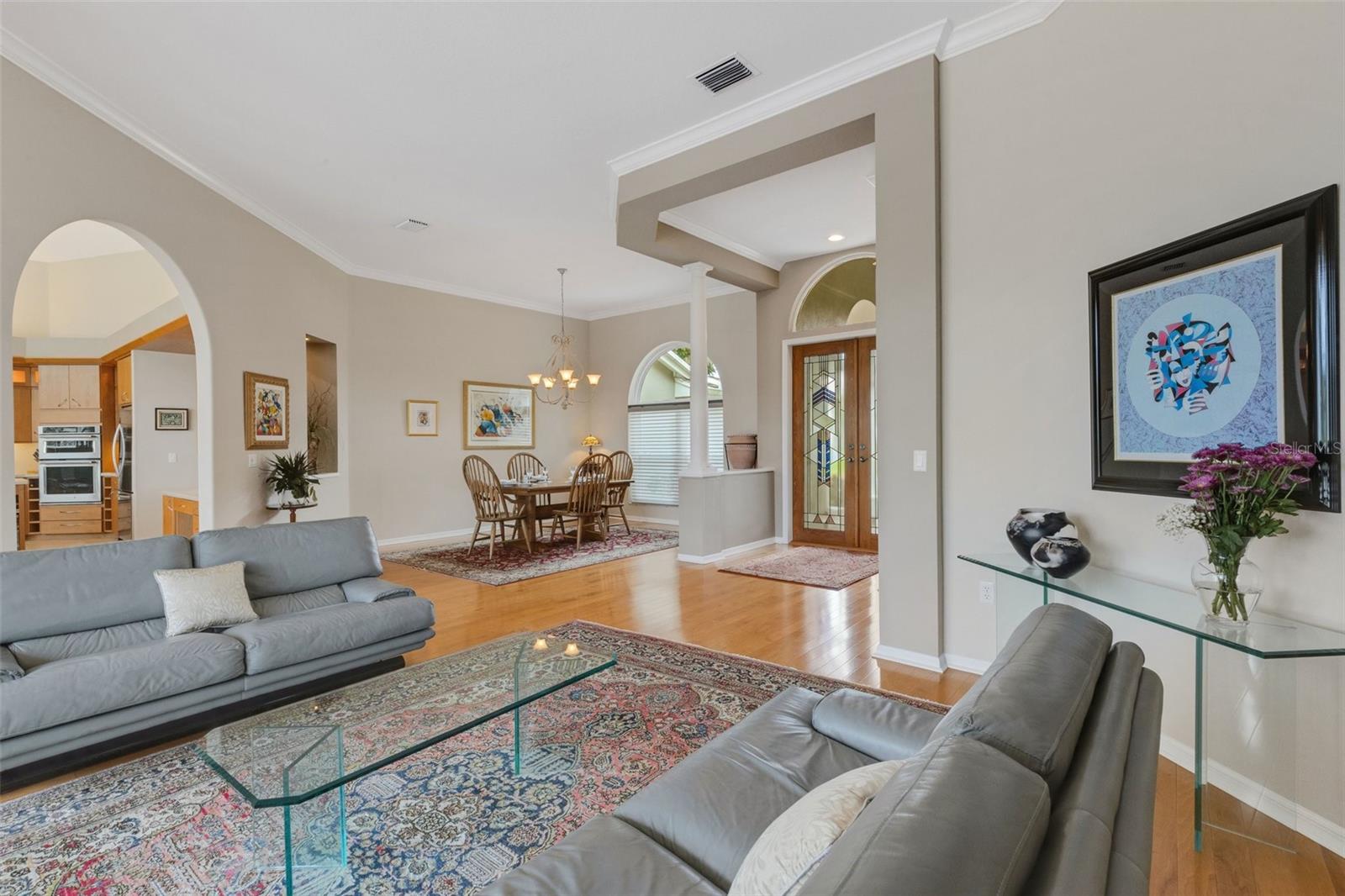 Formal living room, dining room, and entrance to kitchen