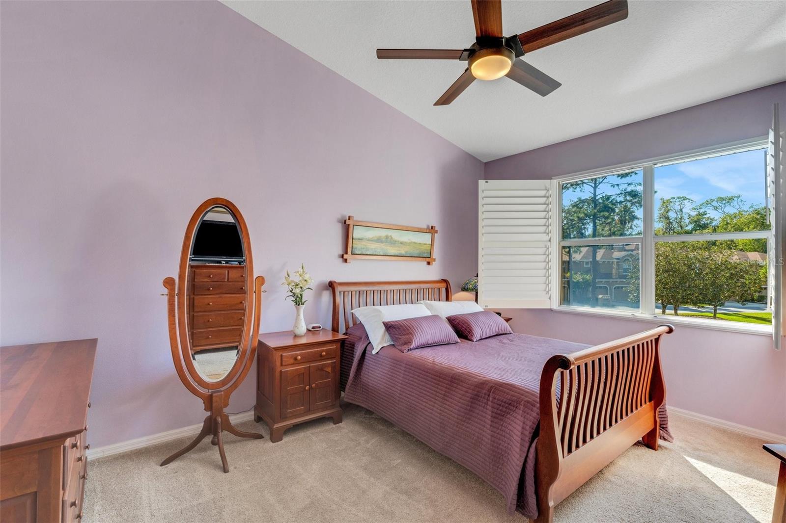 Primary bedroom with views of the pond