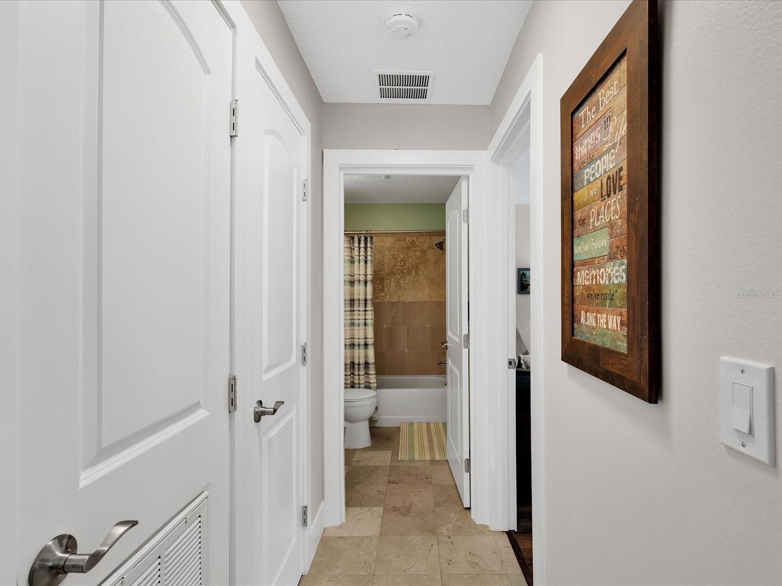 Hallway leading to bathroom & guest bedroom