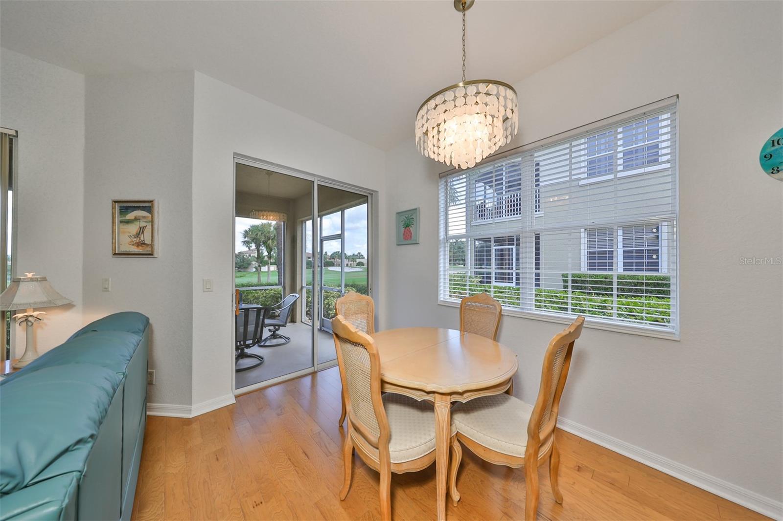 Dinette nook with additional sliding windows and contemporary lighting.