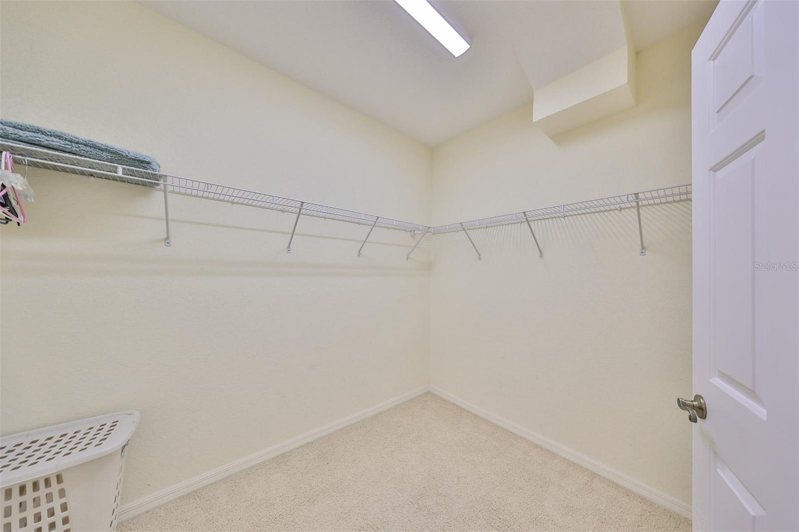 Walk in Primary Bedroom Ensuite Closet with lots of room for his/her storage.