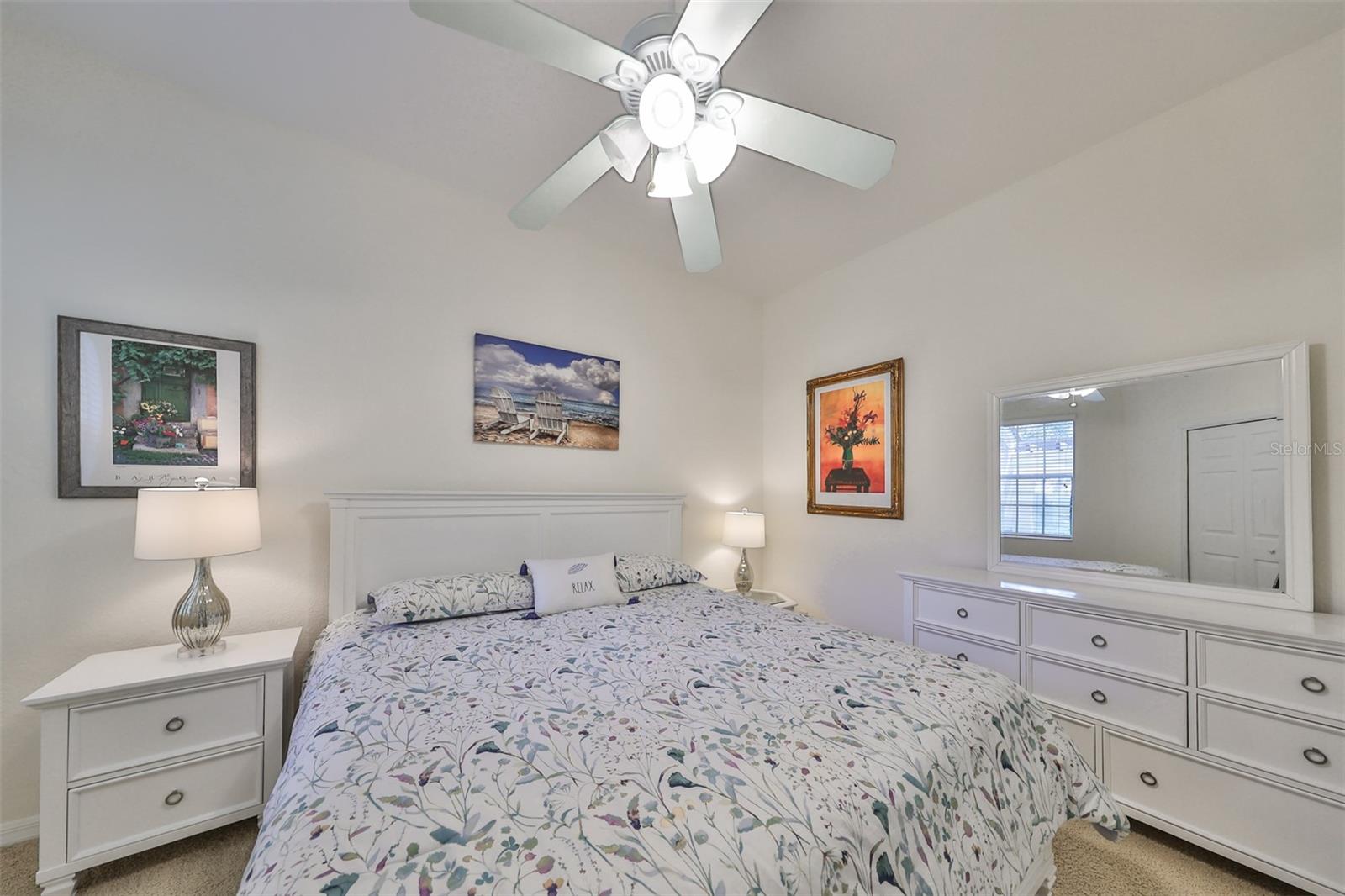 Bedroom #2 has a large window with custom blinds and a ceiling fan.