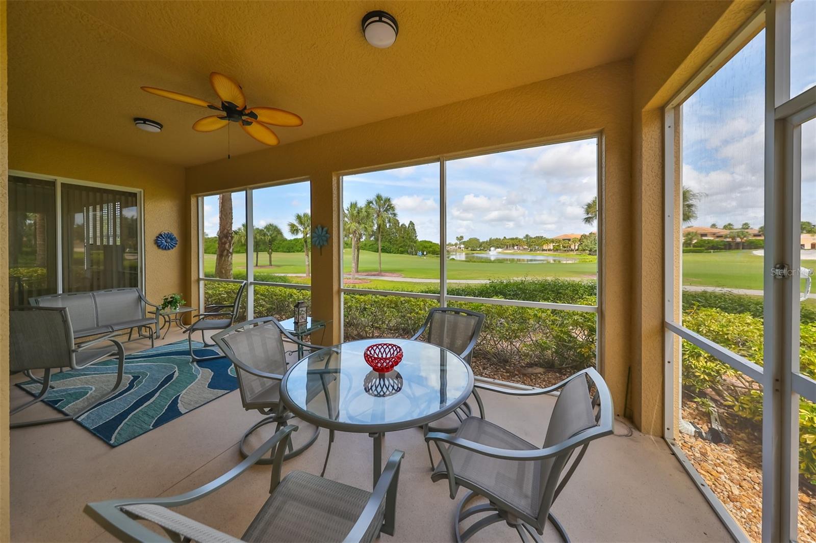 Screened lanai patio perfect for entertaining or enjoying a Florida sunset.