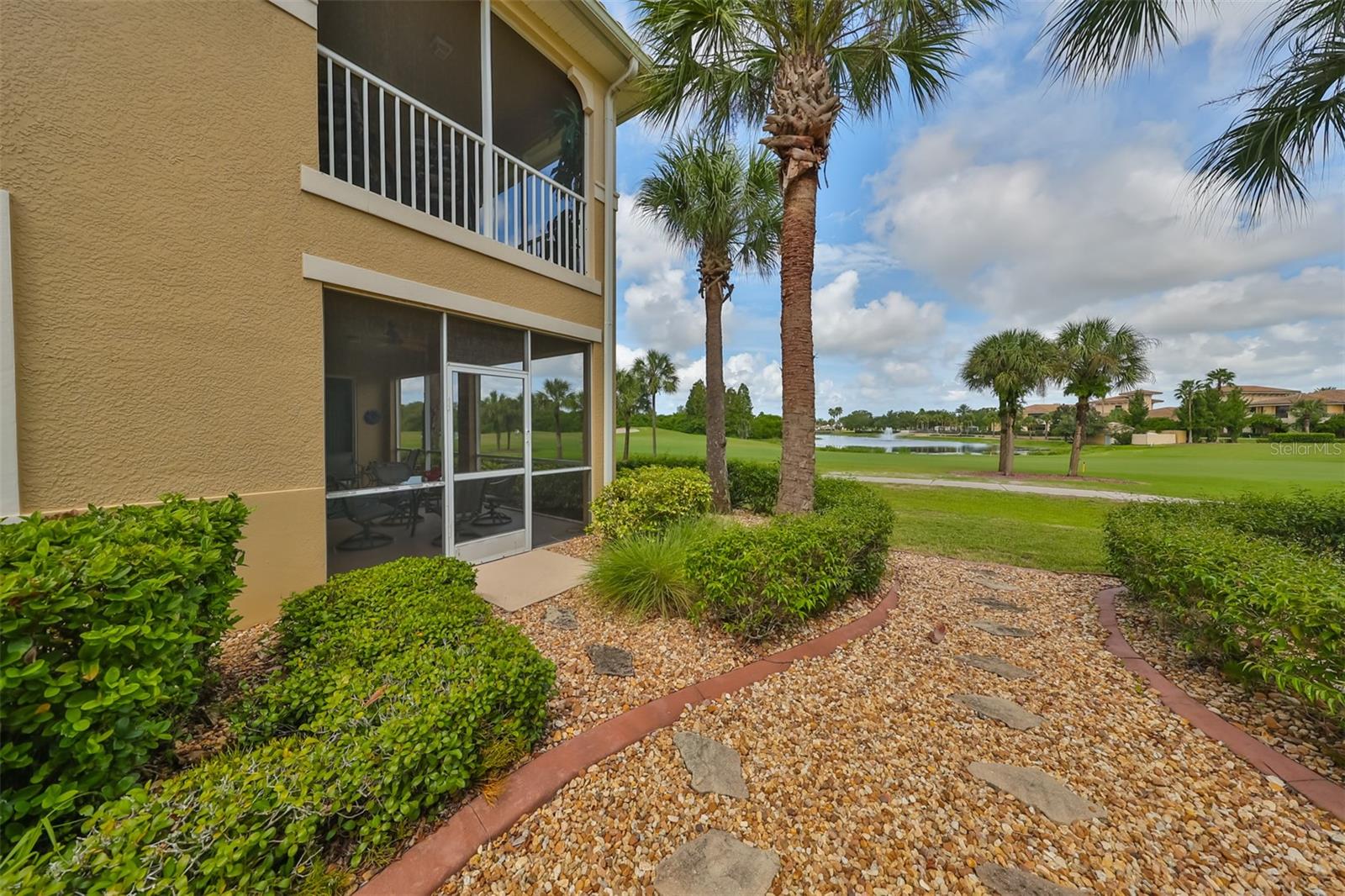 Beautiful golf course, water and clubhouse view from the back patio area.