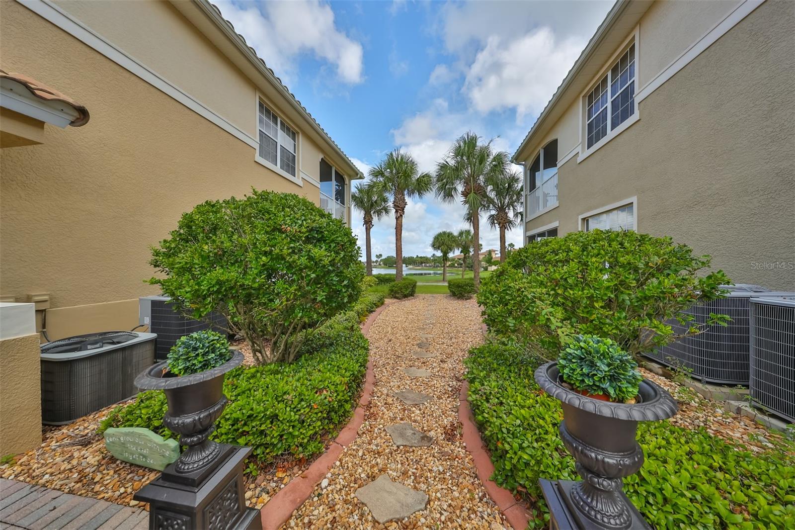 A private walkway takes you to the back yard, from the front door area.  Youimmediately feel the presence of lush tropical greenery that is beautifully landscaped