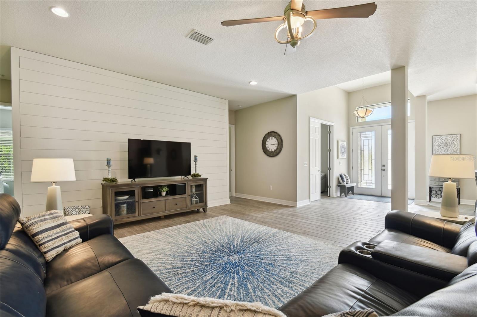 LARGE FAMILY ROOM OVERLOOKING FRONT DOOR AND OFFICE