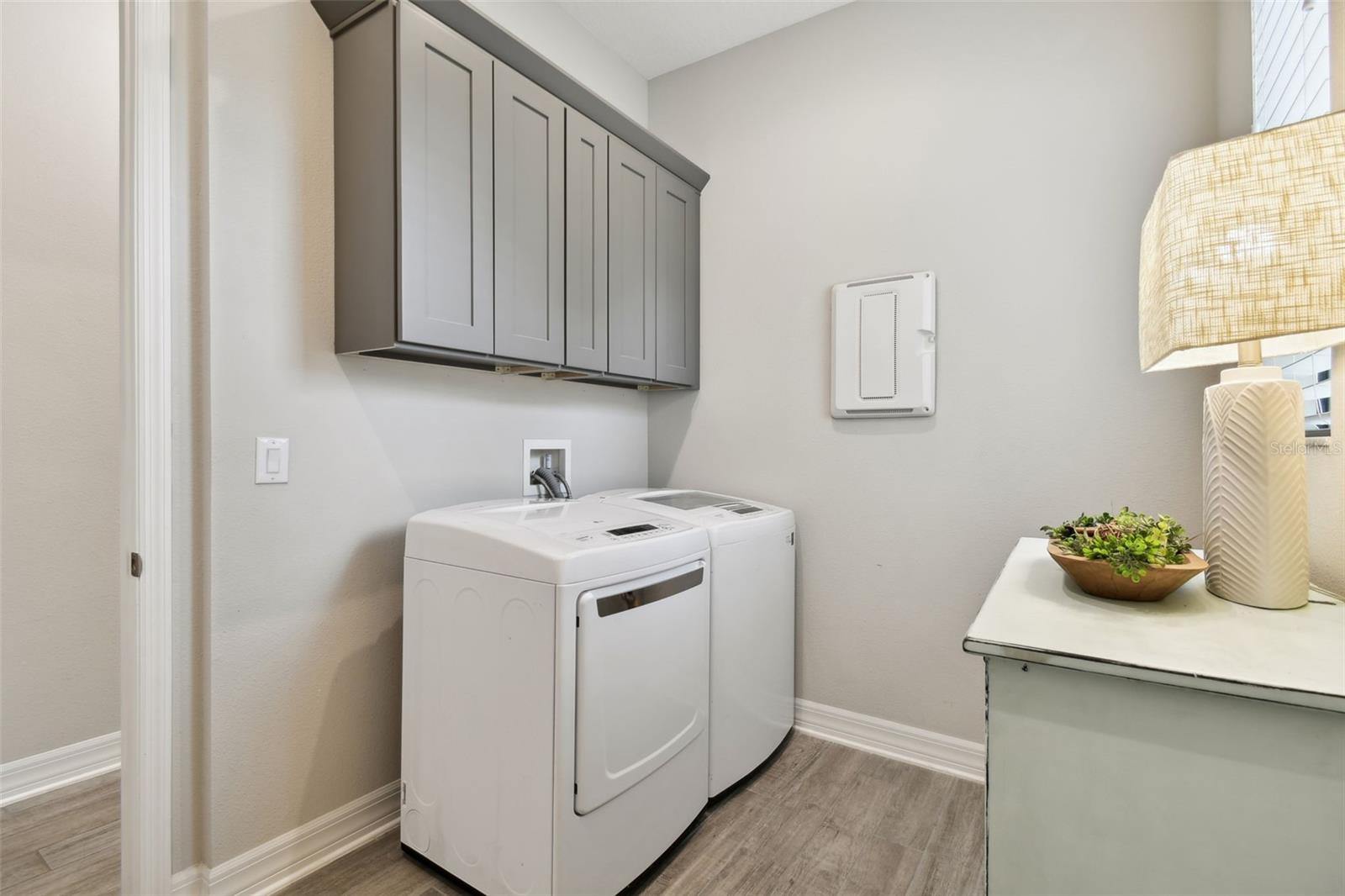 LAUNDRY ROOM WITH STORAGE CABINETS