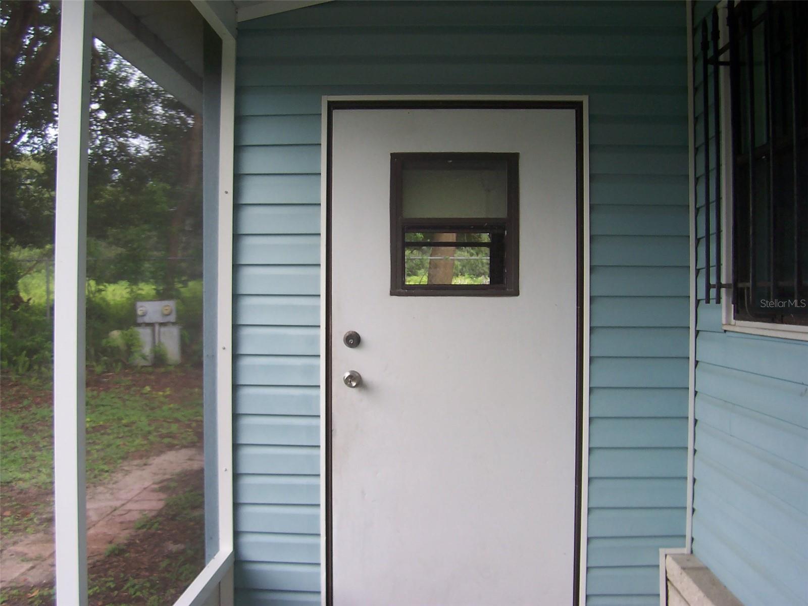 Enclosed porch showing laundry room/storage