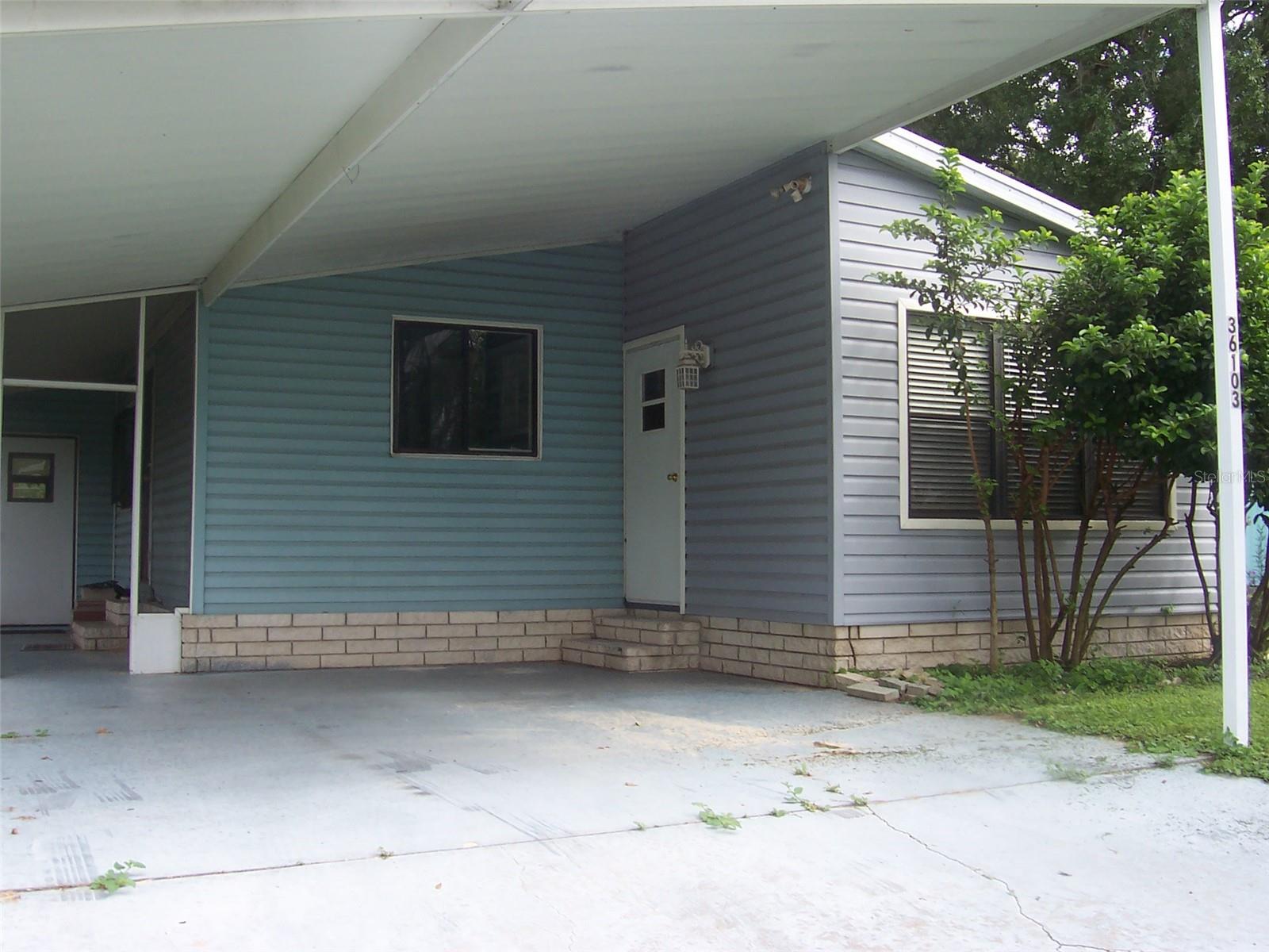 Under carport parking for staying dry during those rainy days.