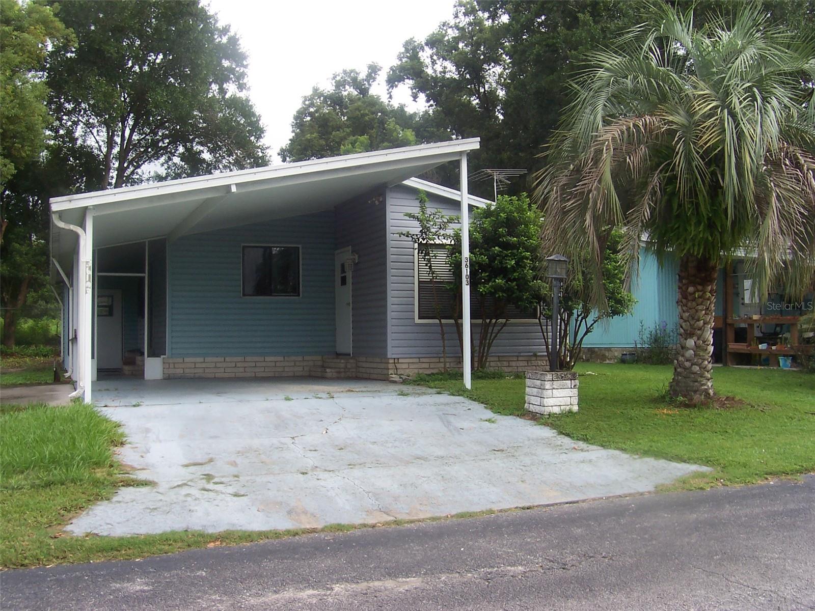 Screen room on side of house plus an enclosed room to the front.