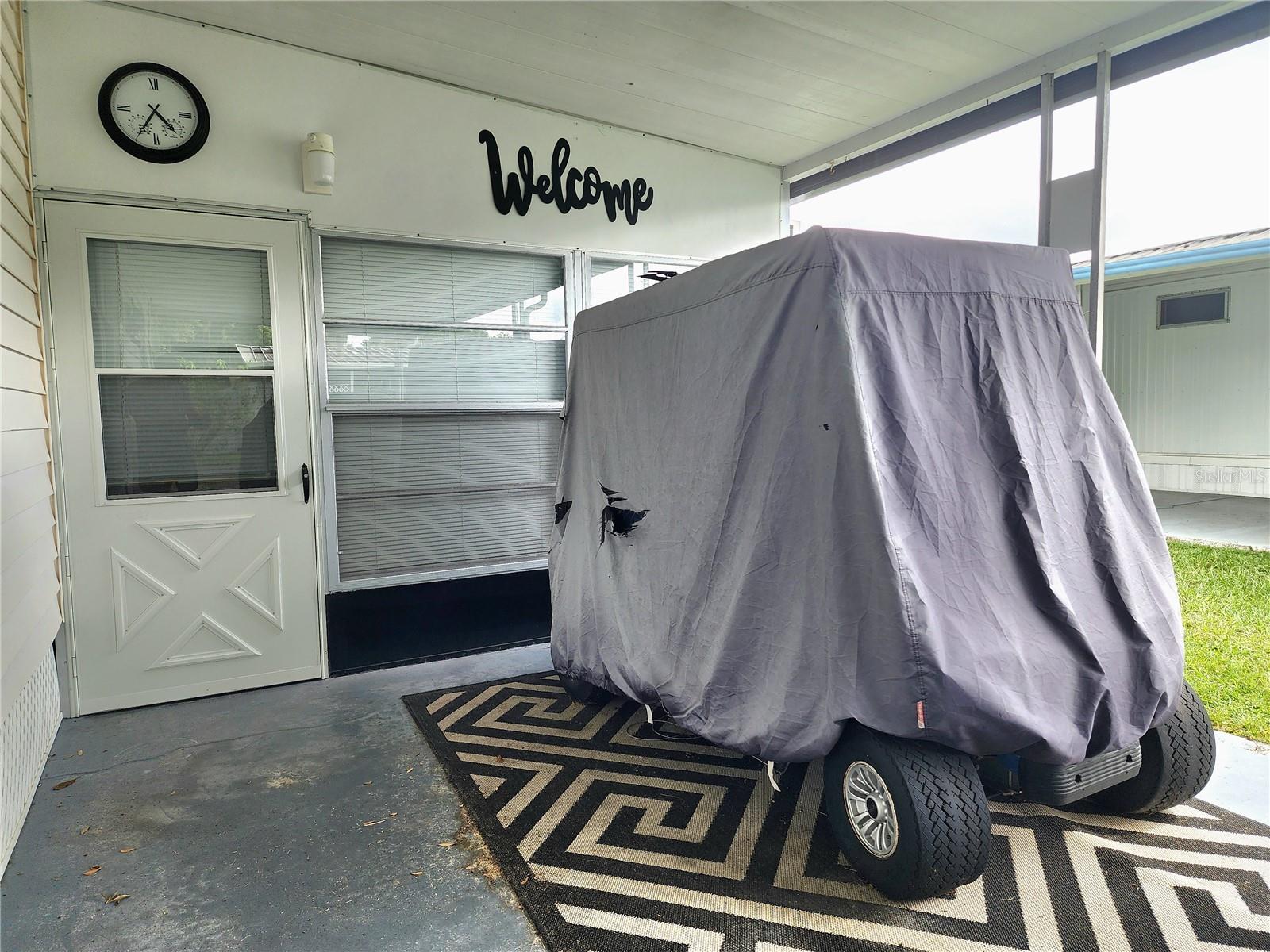 Golf cart & Florida room entry.