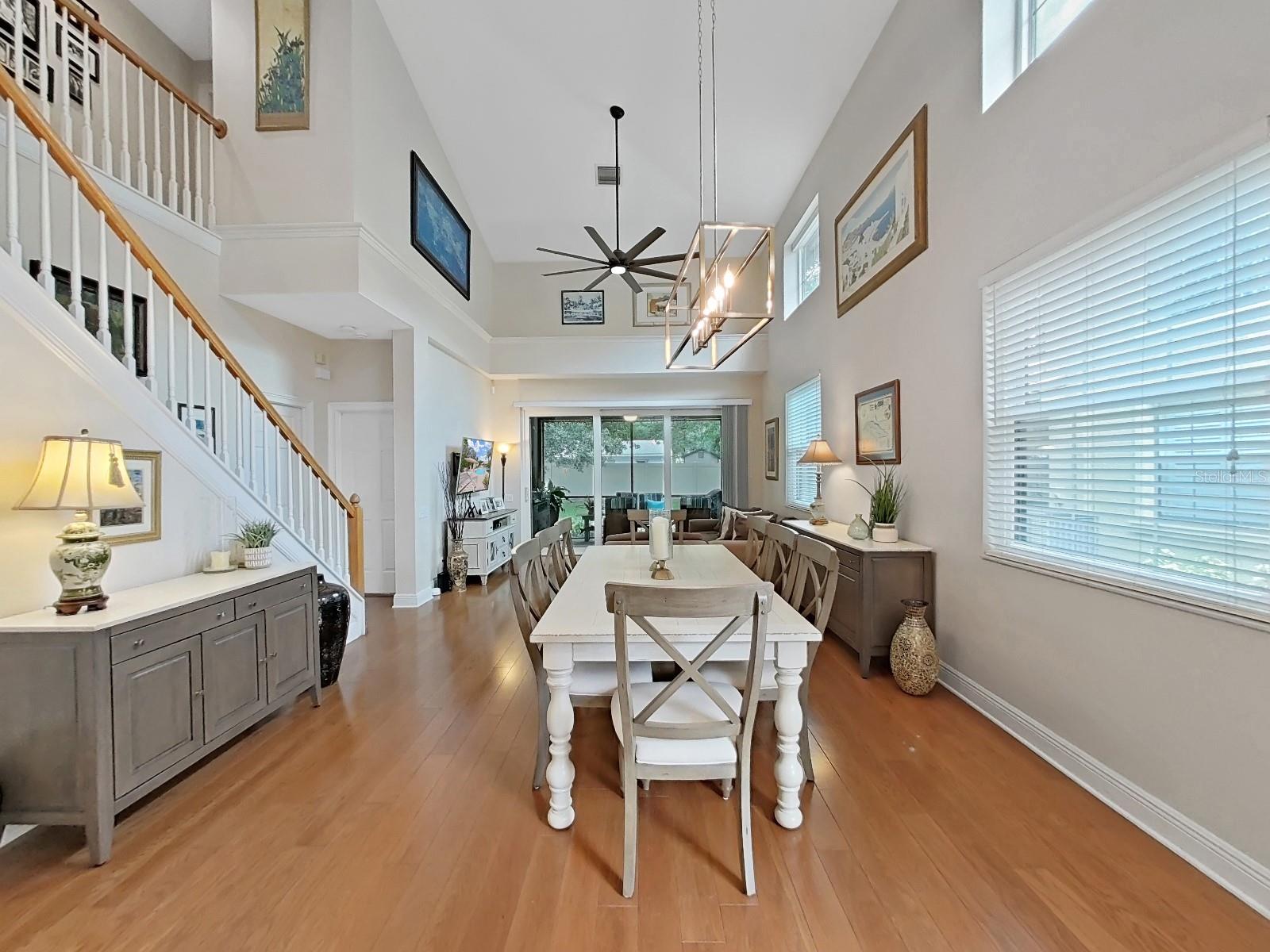 Great room looks out onto screened porch with pavers