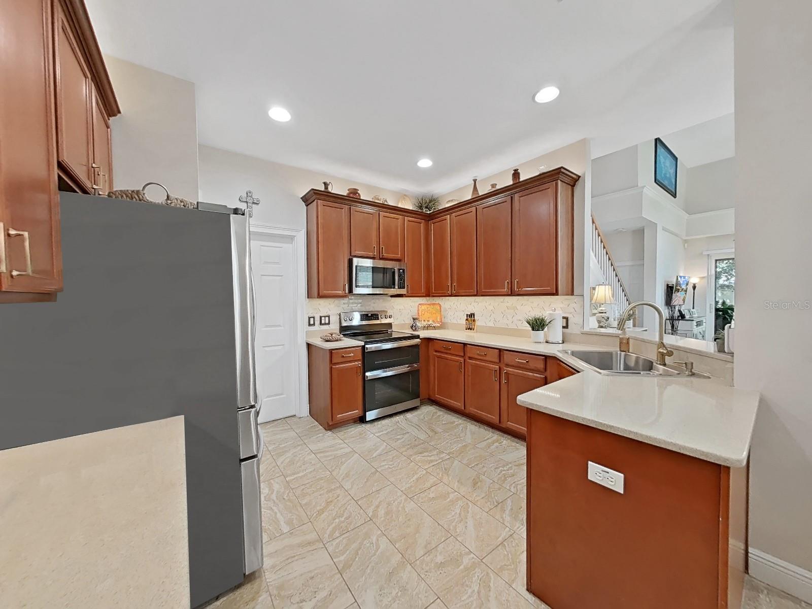 Quartz countertops in kitchen and on bar