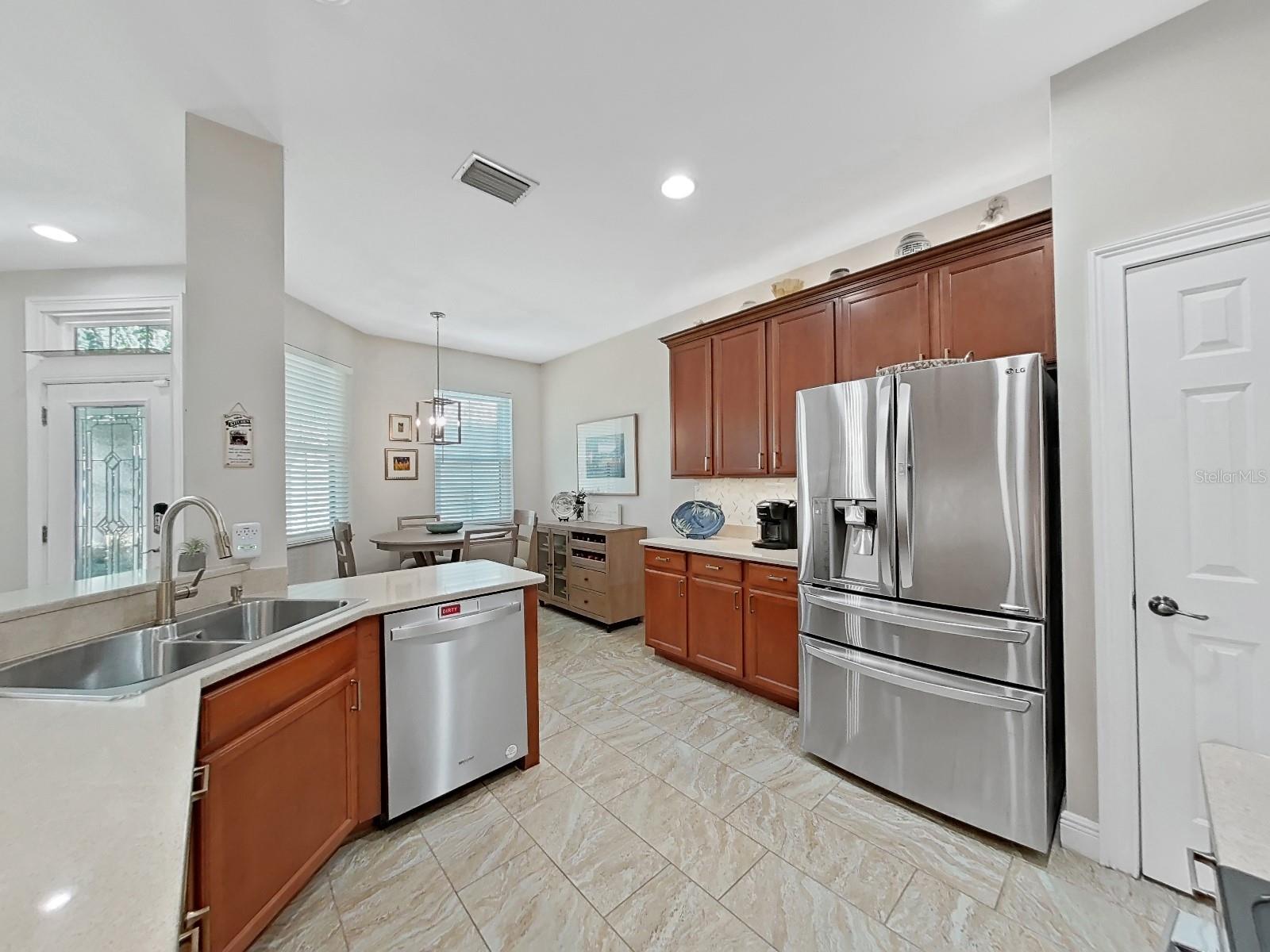 Lighting fixtures in dinette and over dining room table are new. Kitchen has a closet pantry in addition to the custom shelving under stairs for more pantry and small appliance storage